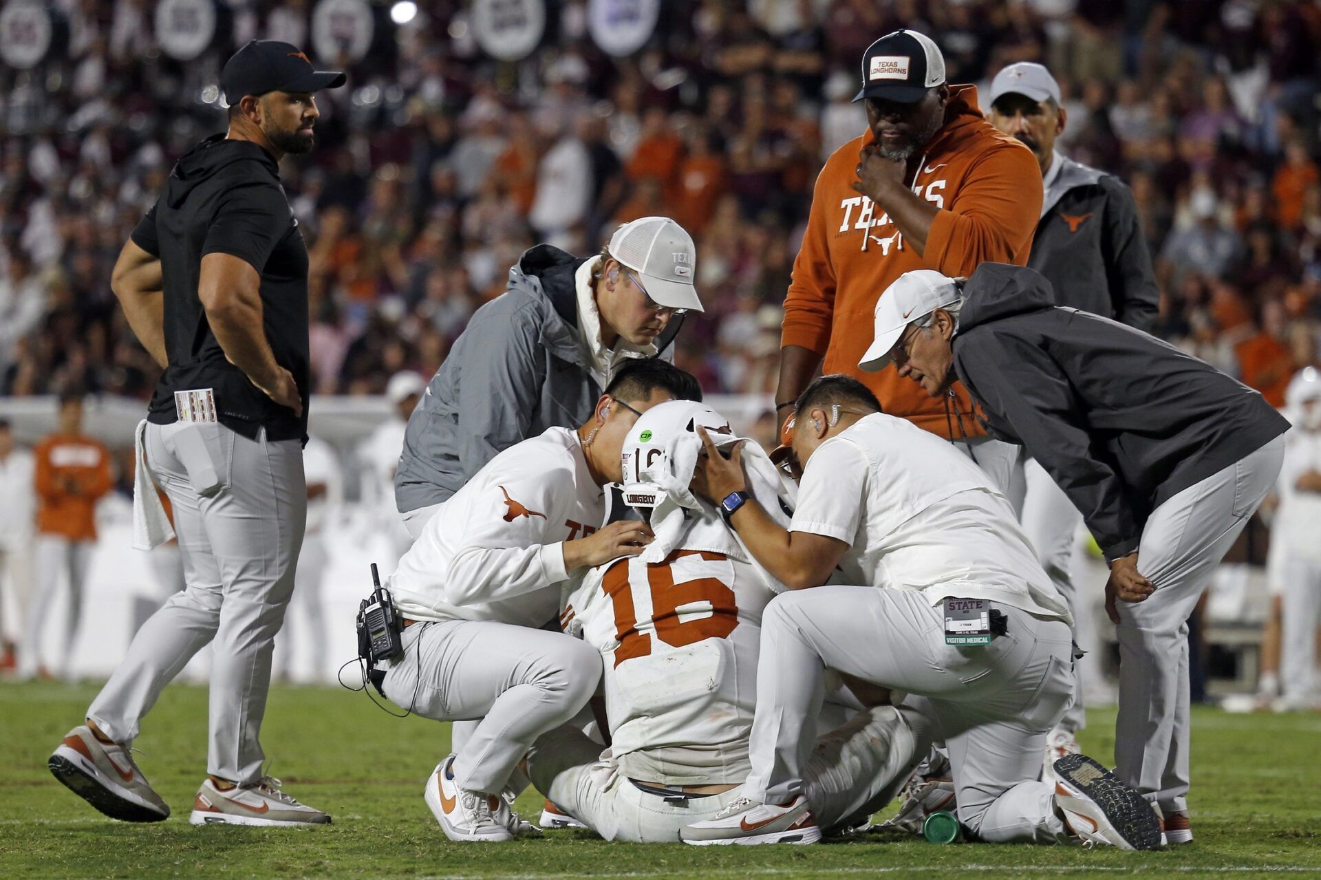 Medical staff check on Texas Longhorns quarterback Arch Manning (16) during overtime against the Mississippi State Bulldogs at Davis Wade Stadium at Scott Field.