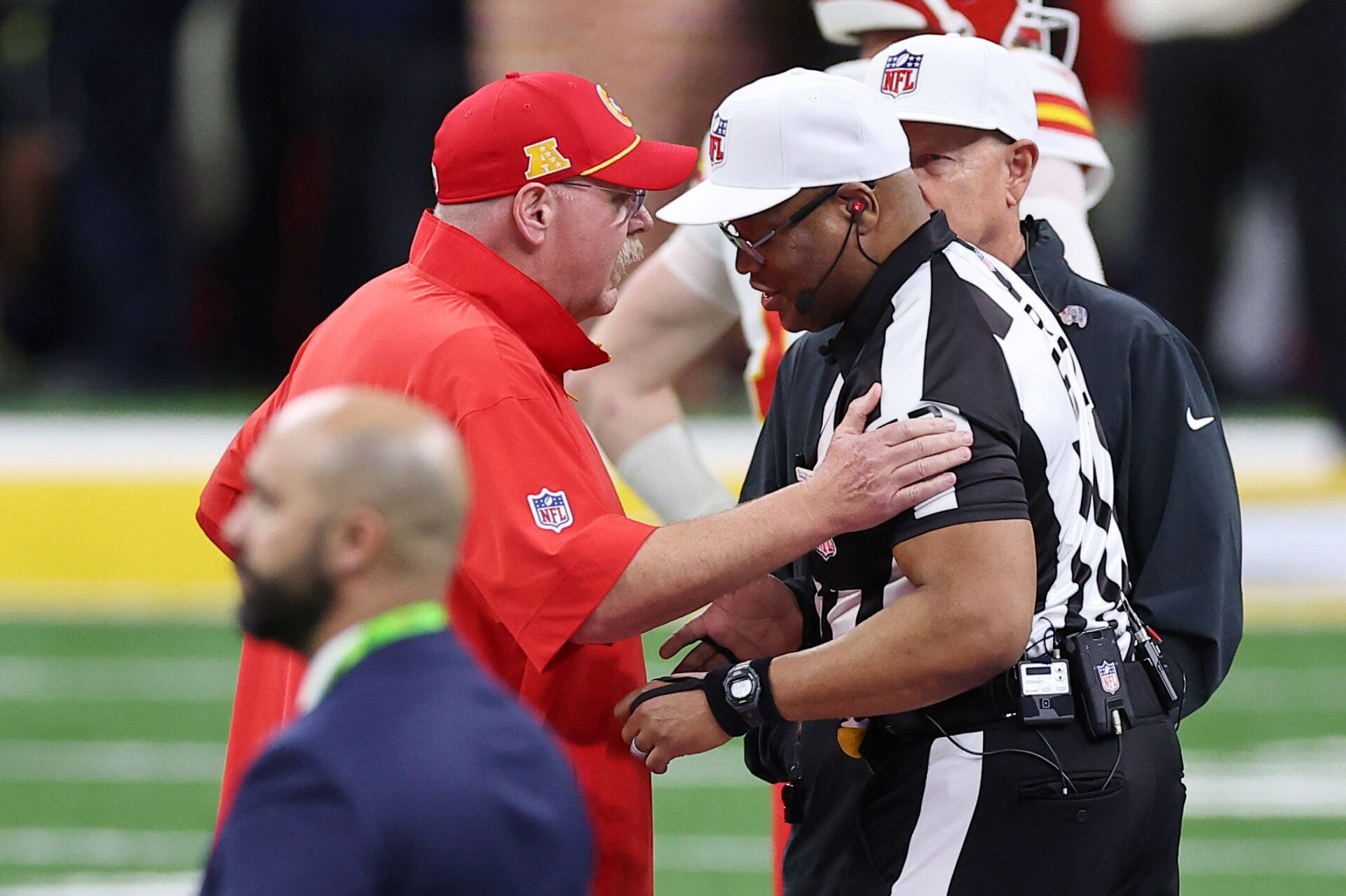 Kansas City Chiefs head coach Andy Reid greets the referee before Super Bowl LIX between the Philadelphia Eagles and the Kansas City Chiefs at Caesars Superdome.