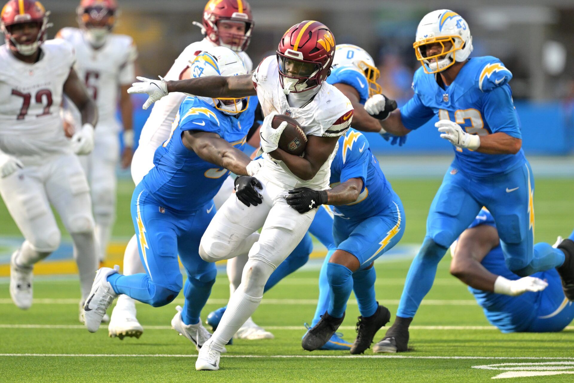 Washington Commanders running back Jacory Croskey-Merritt (22) runs against the Los Angeles Chargers in the second half at SoFi Stadium.