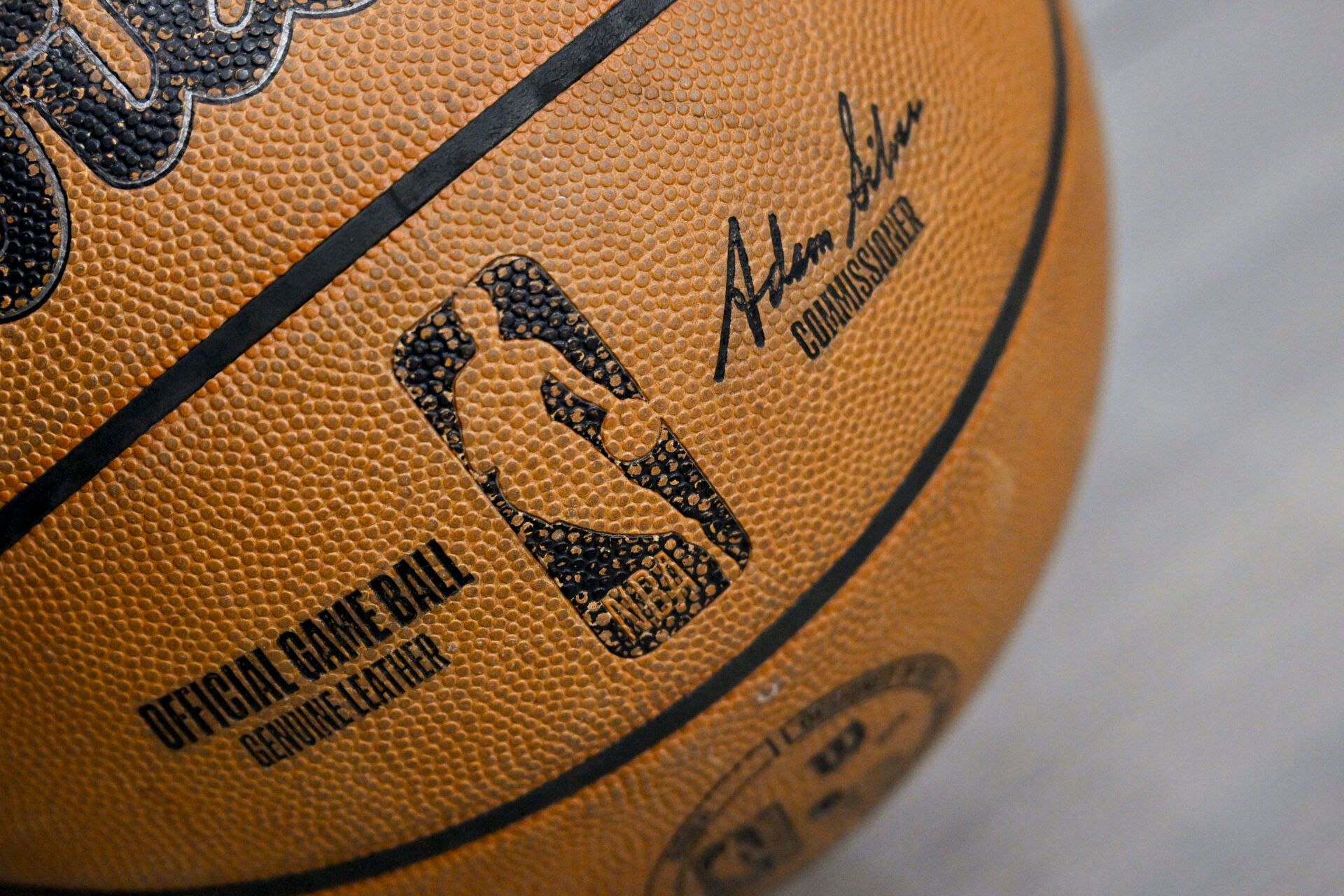 A view of an NBA basketball and the NBA logo before the game between the Dallas Mavericks and the Toronto Raptors at the American Airlines Center.