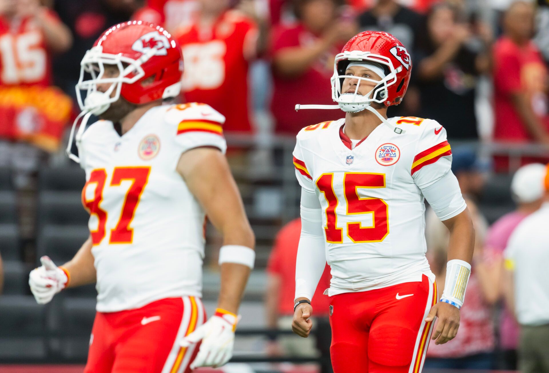 Kansas City Chiefs quarterback Patrick Mahomes (15) and tight end Travis Kelce (87) against the Arizona Cardinals during a preseason NFL game at State Farm Stadium.