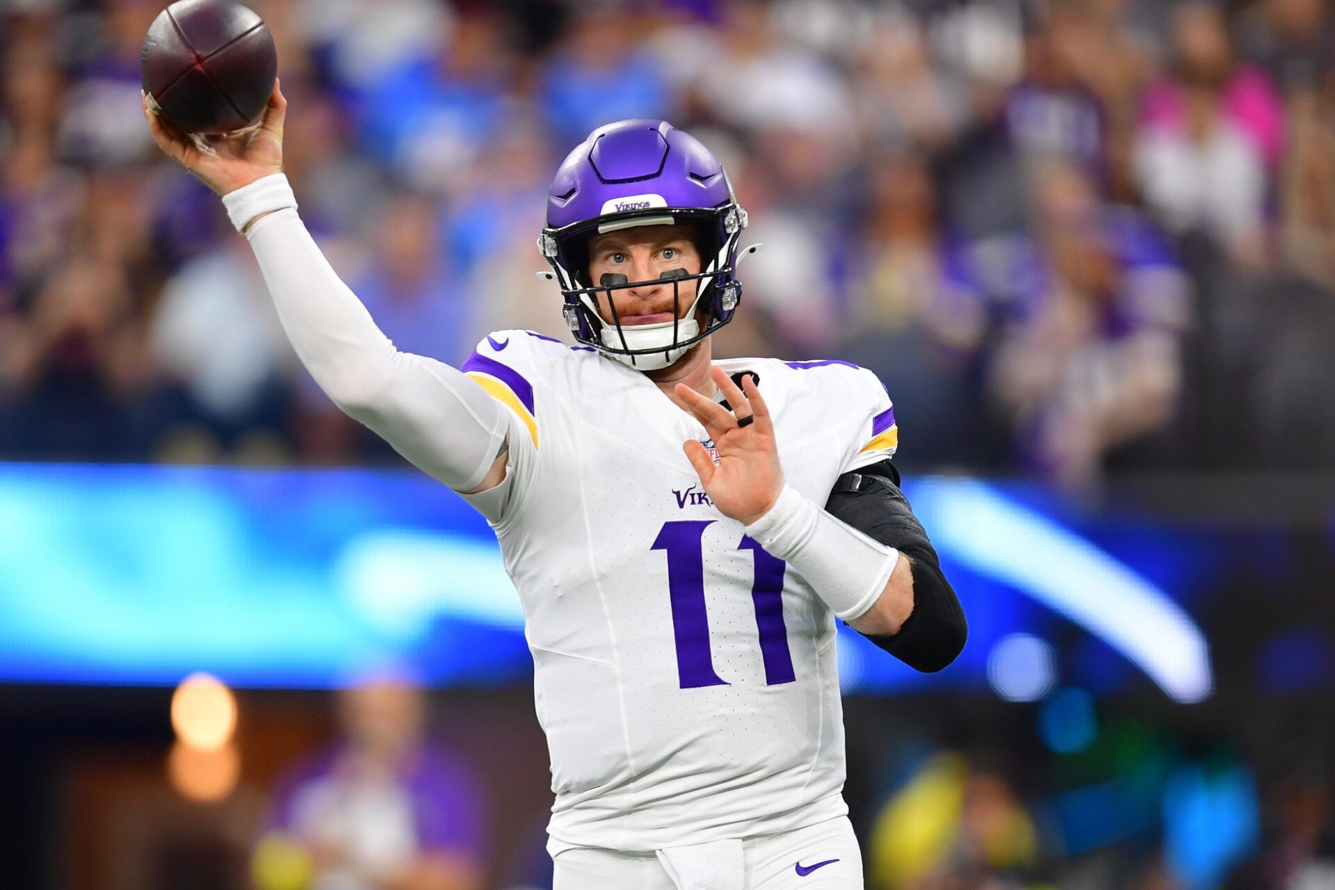 Minnesota Vikings quarterback Carson Wentz (11) drops back to pass against the Los Angeles Chargers during the first half at SoFi Stadium.