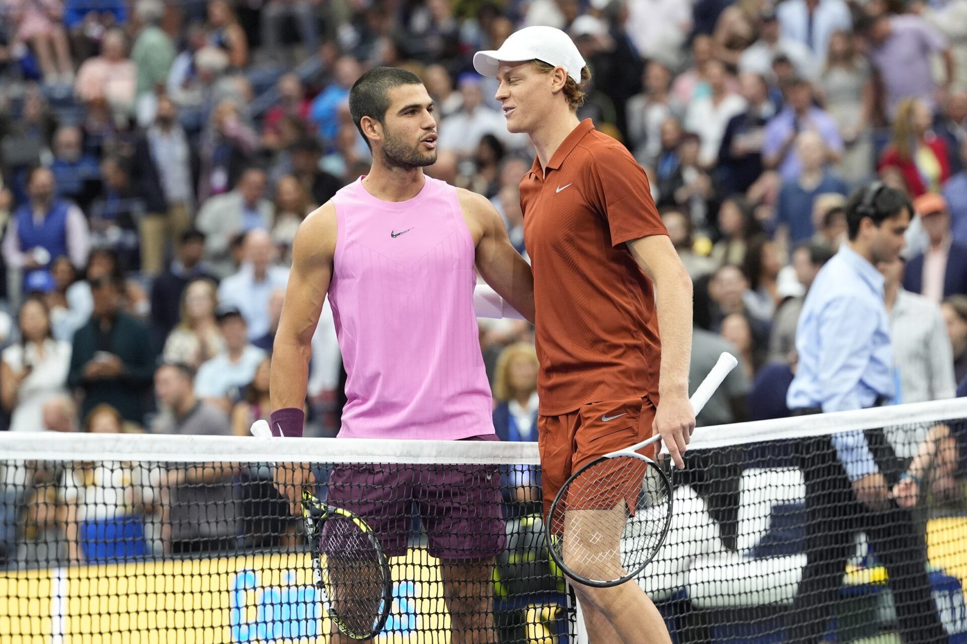 Carlos Alcaraz (ESP) and Jannik Sinner (ITA) pose for a photos a the net prior to the final of mens singles at Billie Jean King National Tennis Center.