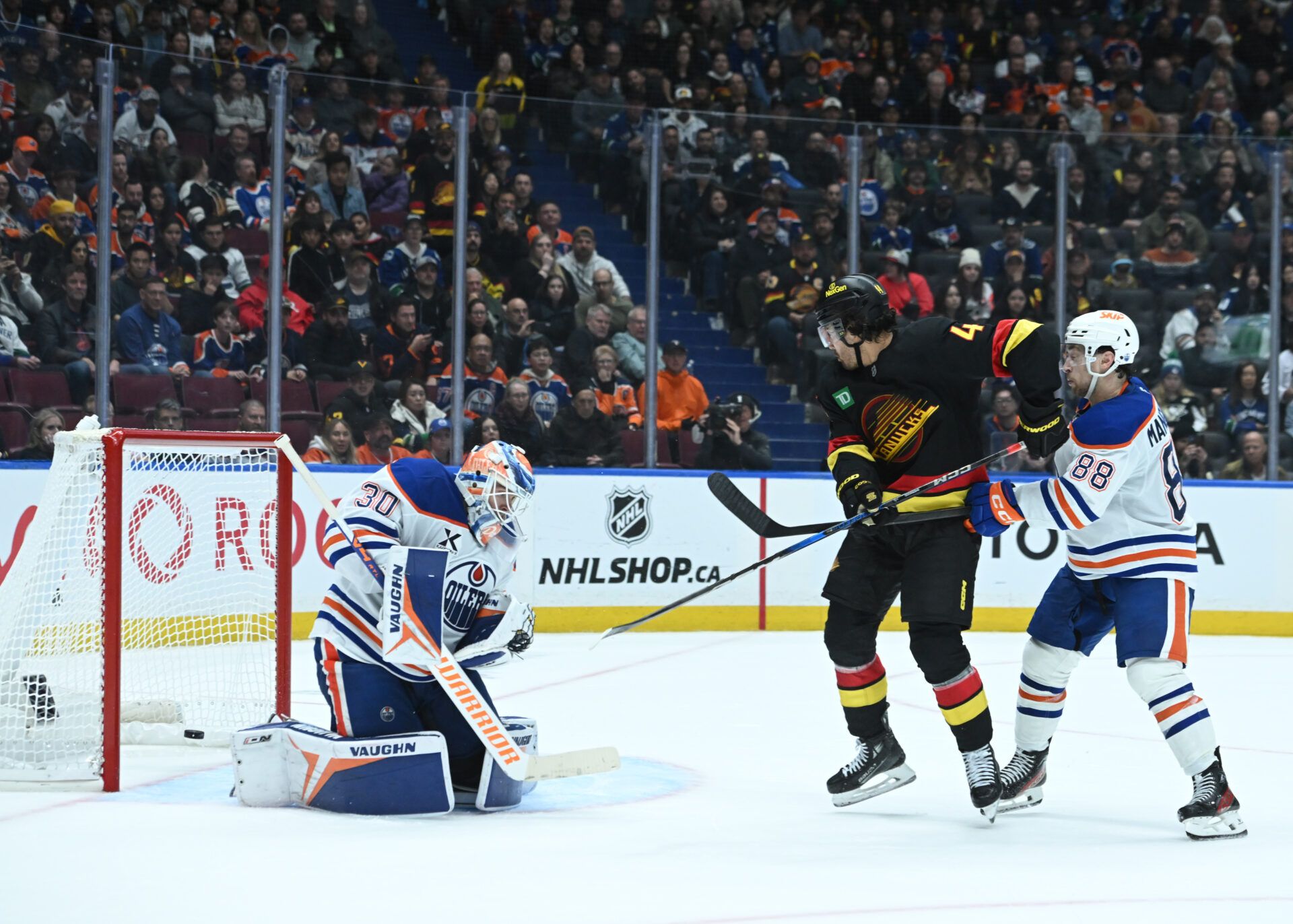 Vancouver Canucks left wing Kiefer Sherwood (44) scores the overtime goal against Edmonton Oilers goaltender Calvin Pickard (30) at Rogers Arena.