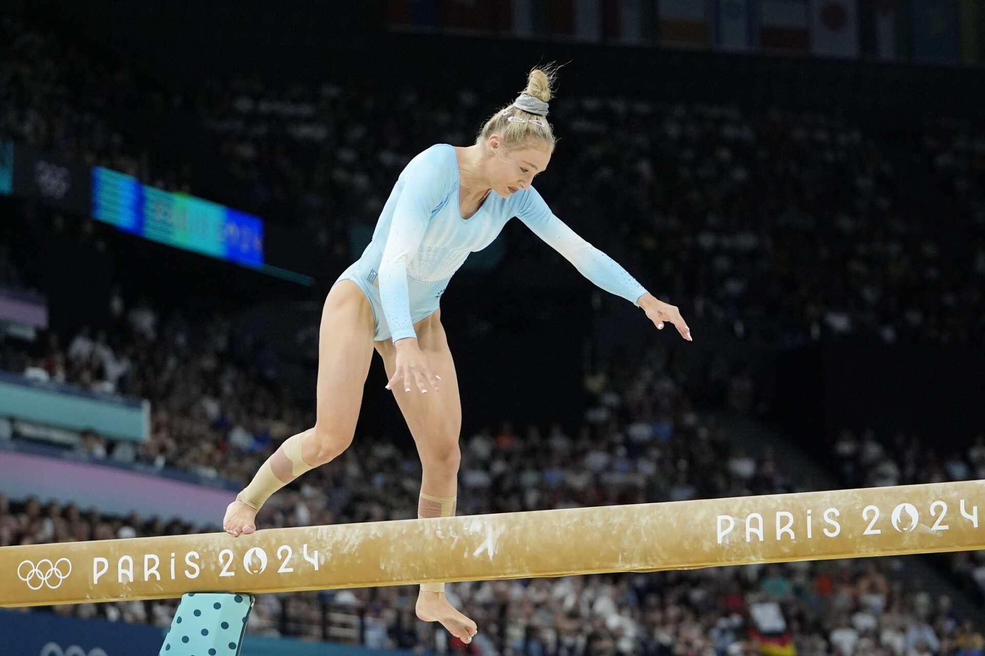 Sabrina Maneca-Voinea of Romania falls off the beam on day three of the gymnastics event finals during the Paris 2024 Olympic Summer Games.