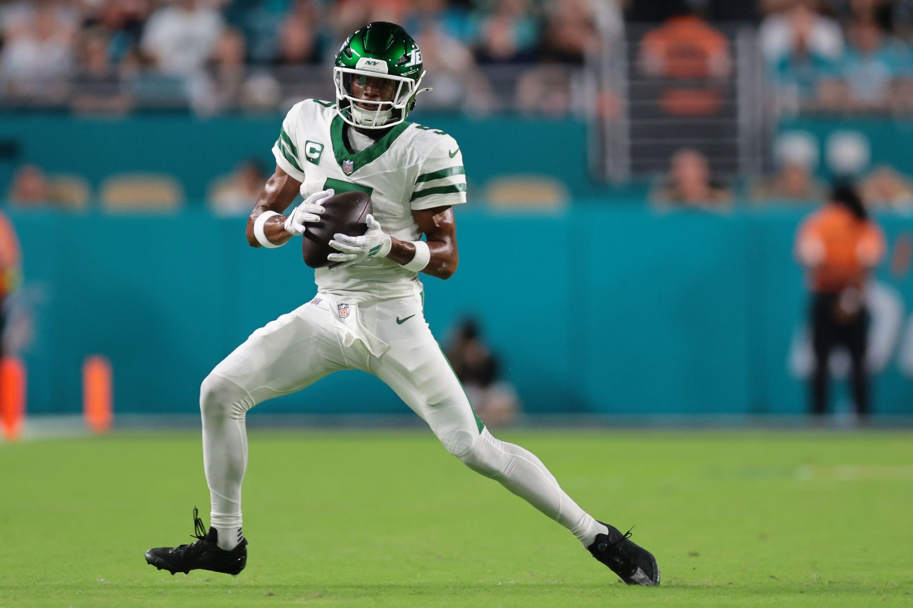 New York Jets wide receiver Garrett Wilson (5) makes a catch against the Miami Dolphins during the first half at Hard Rock Stadium.