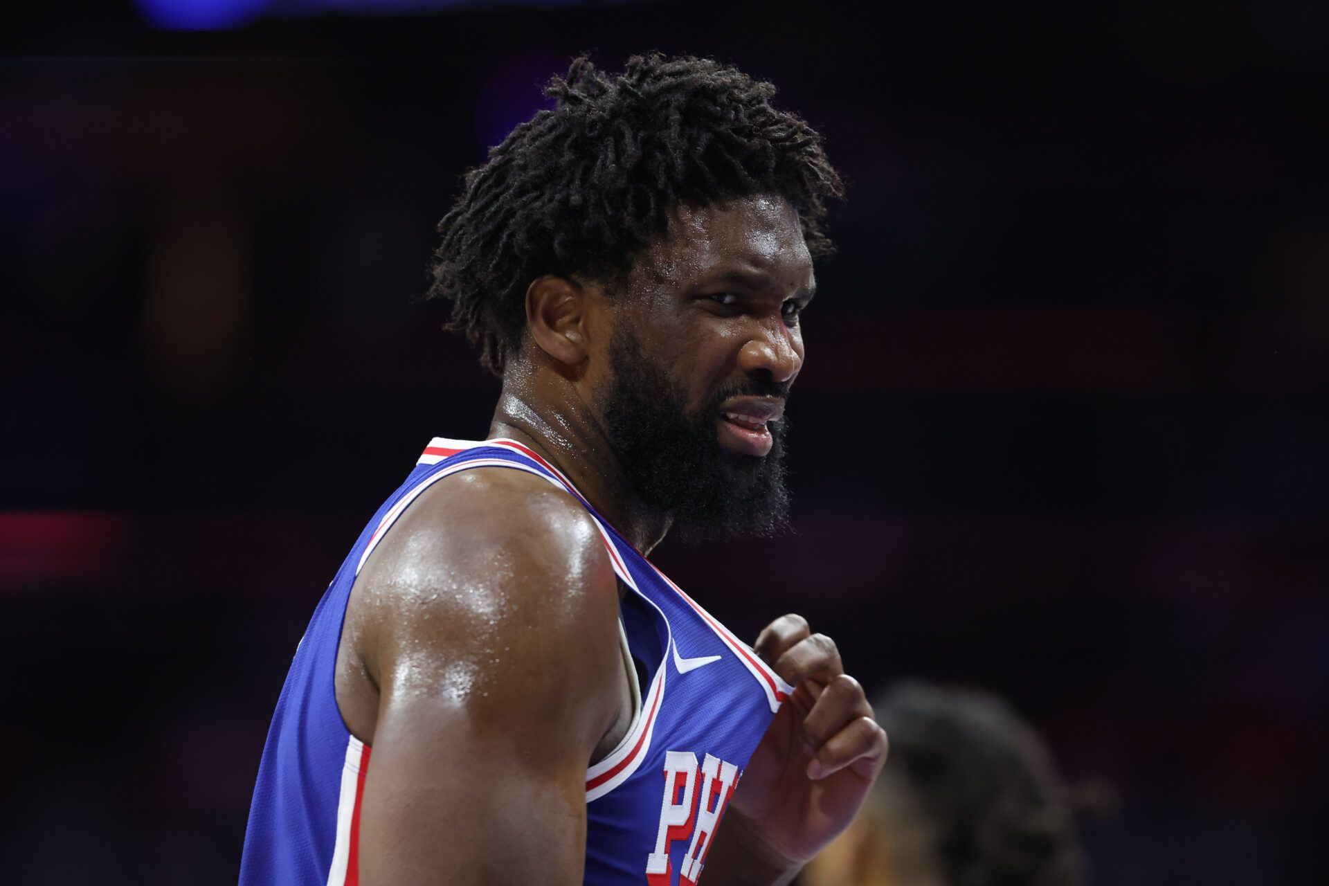 Philadelphia 76ers center Joel Embiid (21) reacts after being hit in the upper body during the third quarter against the Charlotte Hornets at Xfinity Mobile Arena.