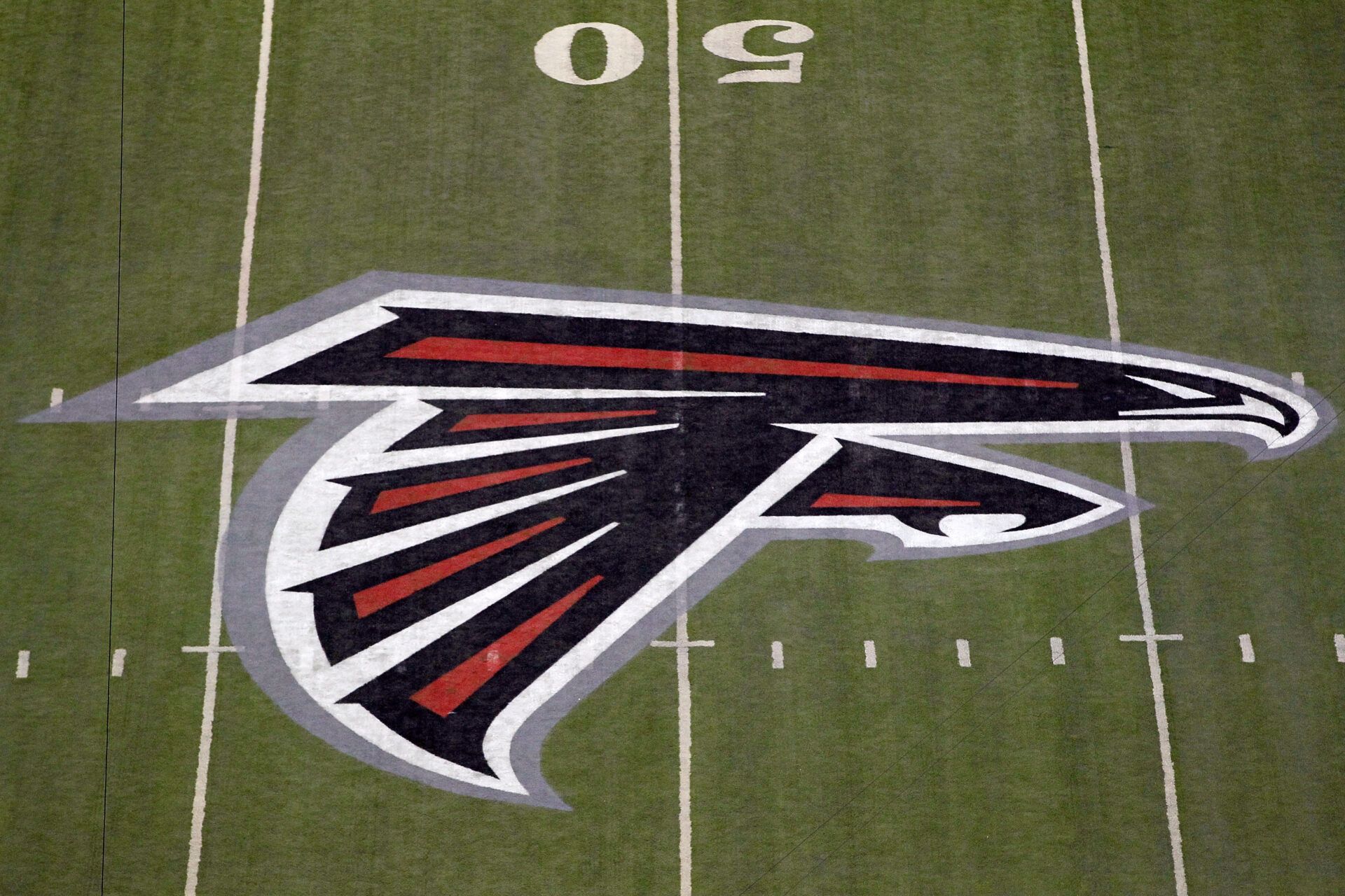 ATLANTA, GA - JANUARY 15:  A detail of the Atlanta Falcons logo is seen at the 50 yard line against the Green Bay Packers during their 2011 NFC divisional playoff game at Georgia Dome on January 15, 2011 in Atlanta, Georgia.  (Photo by Kevin C. Cox/Getty Images)
