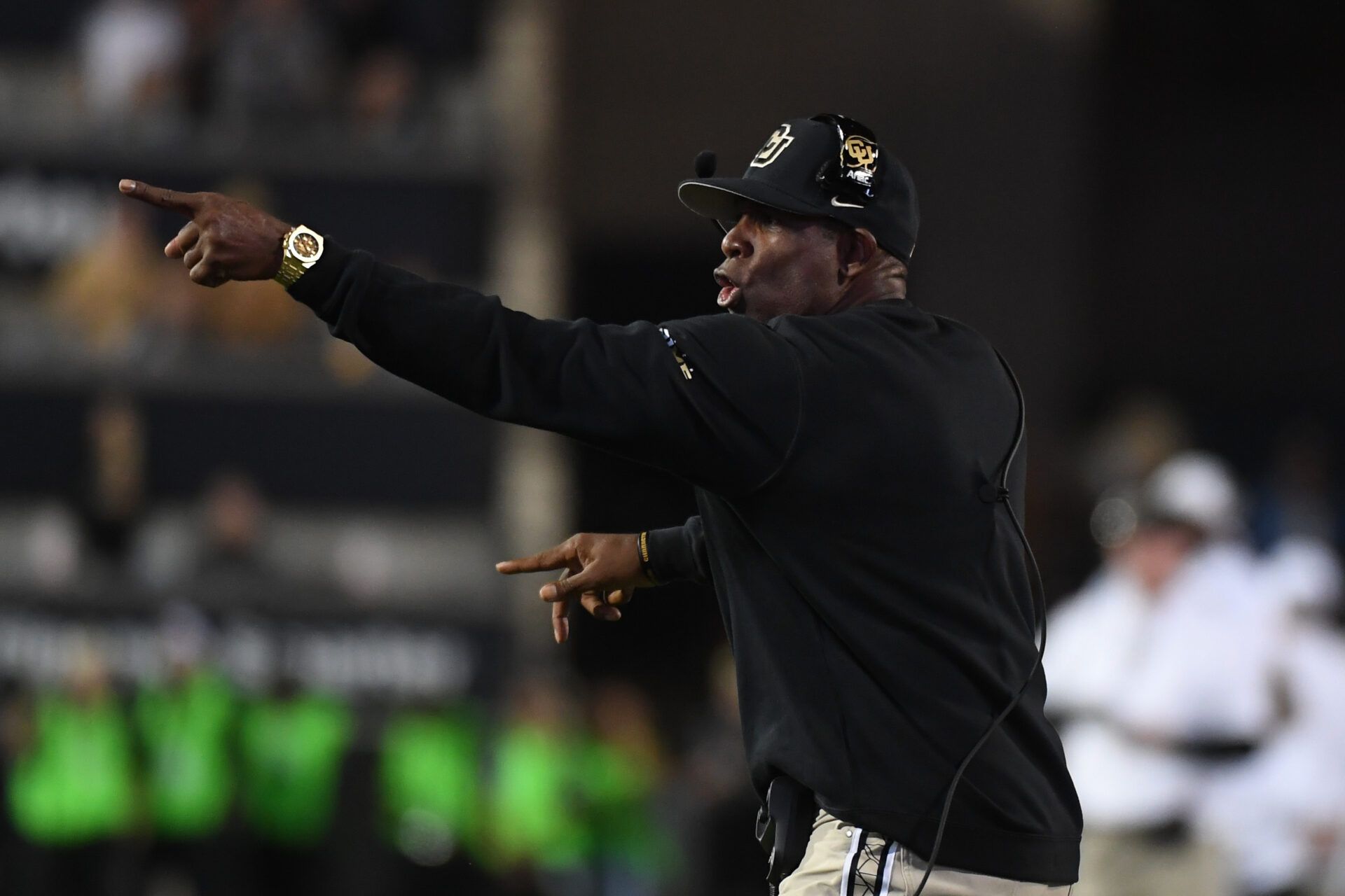Colorado Buffaloes head coach Deion Sanders yells to his players during the second half against the Kansas State Wildcats at Folsom Field.