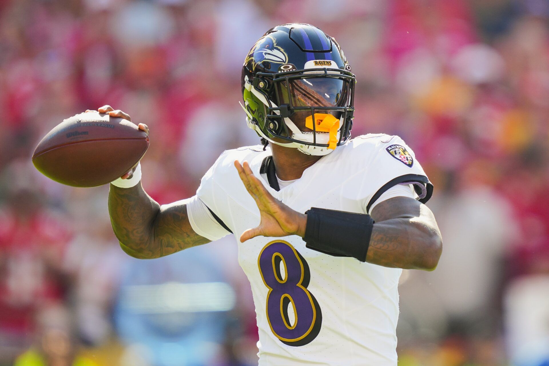 Baltimore Ravens quarterback Lamar Jackson (8) throws a pass during the first half against the Kansas City Chiefs at GEHA Field at Arrowhead Stadium.