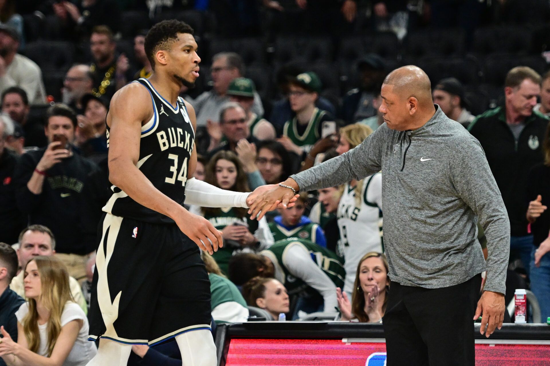Milwaukee Bucks forward Giannis Antetokounmpo (34) exits the game in the fourth quarter as head coach Doc Rivers shakes his hand during game four against the Indiana Pacers of first round for the 2024 NBA Playoffs at Fiserv Forum.