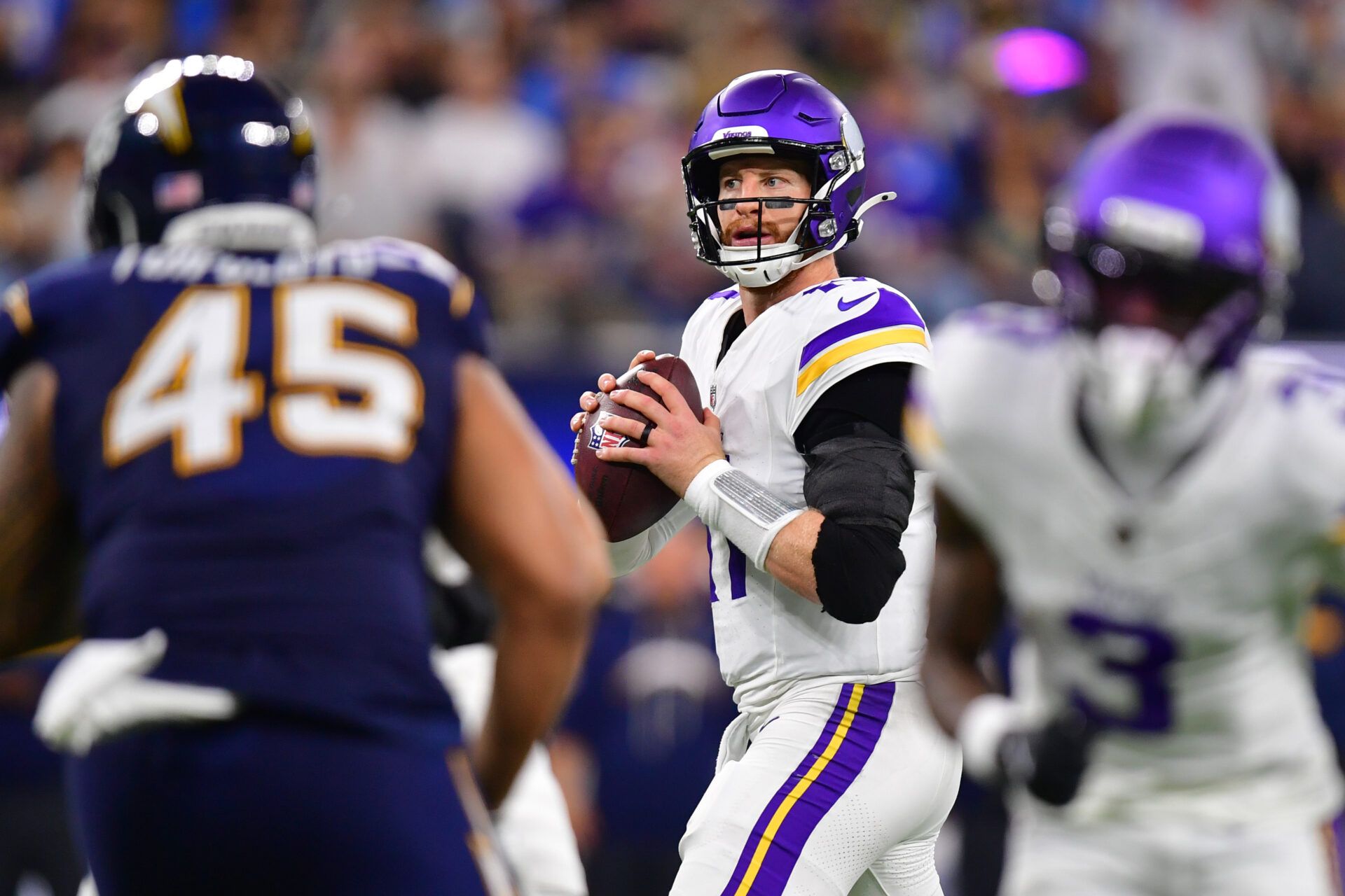 Minnesota Vikings quarterback Carson Wentz (11) drops back to pass against the Los Angeles Chargers during the second half at SoFi Stadium.