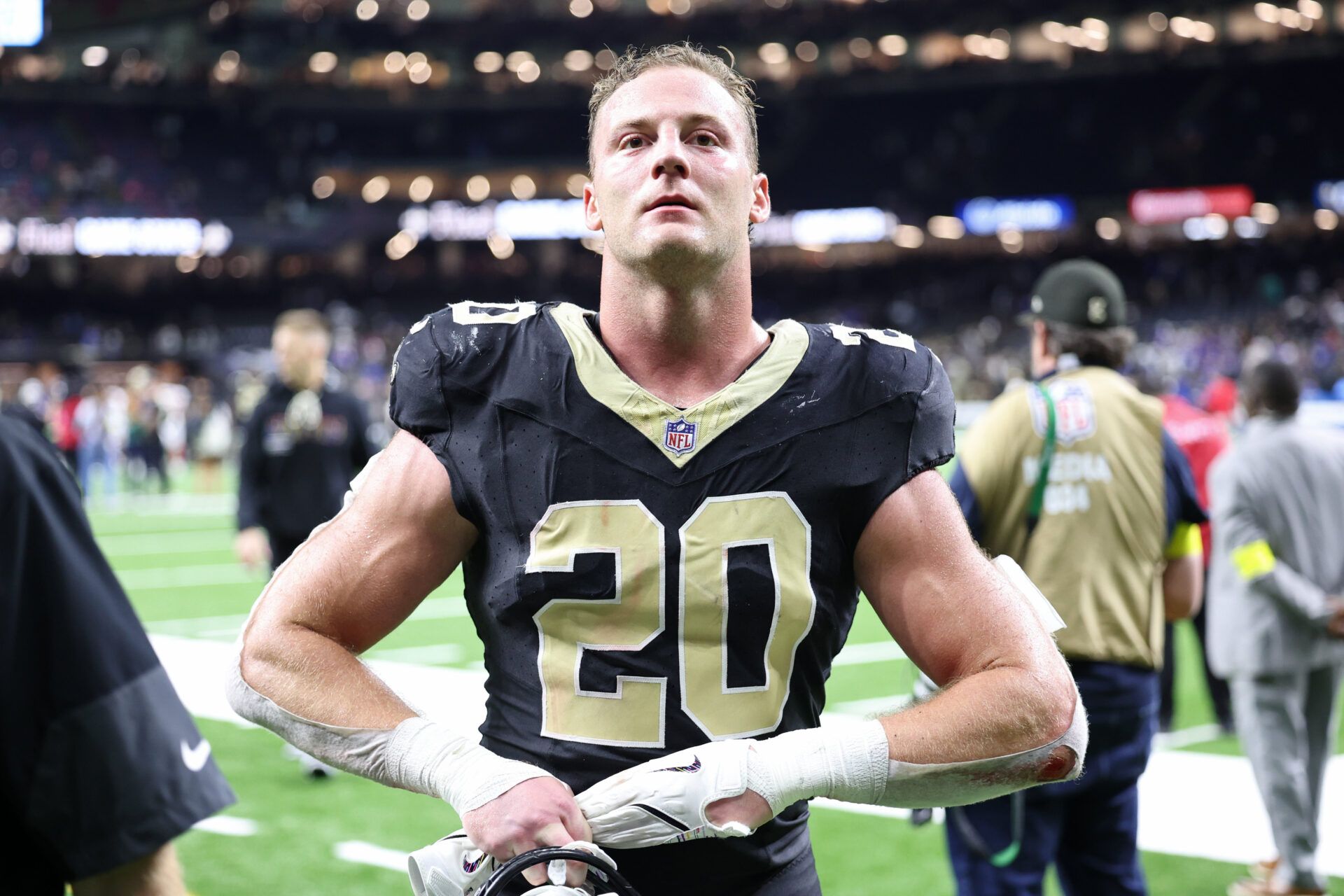 New Orleans Saints linebacker Pete Werner (20) takes off his gloves as he walks off the field after their win against the New York Giants at Caesars Superdome.