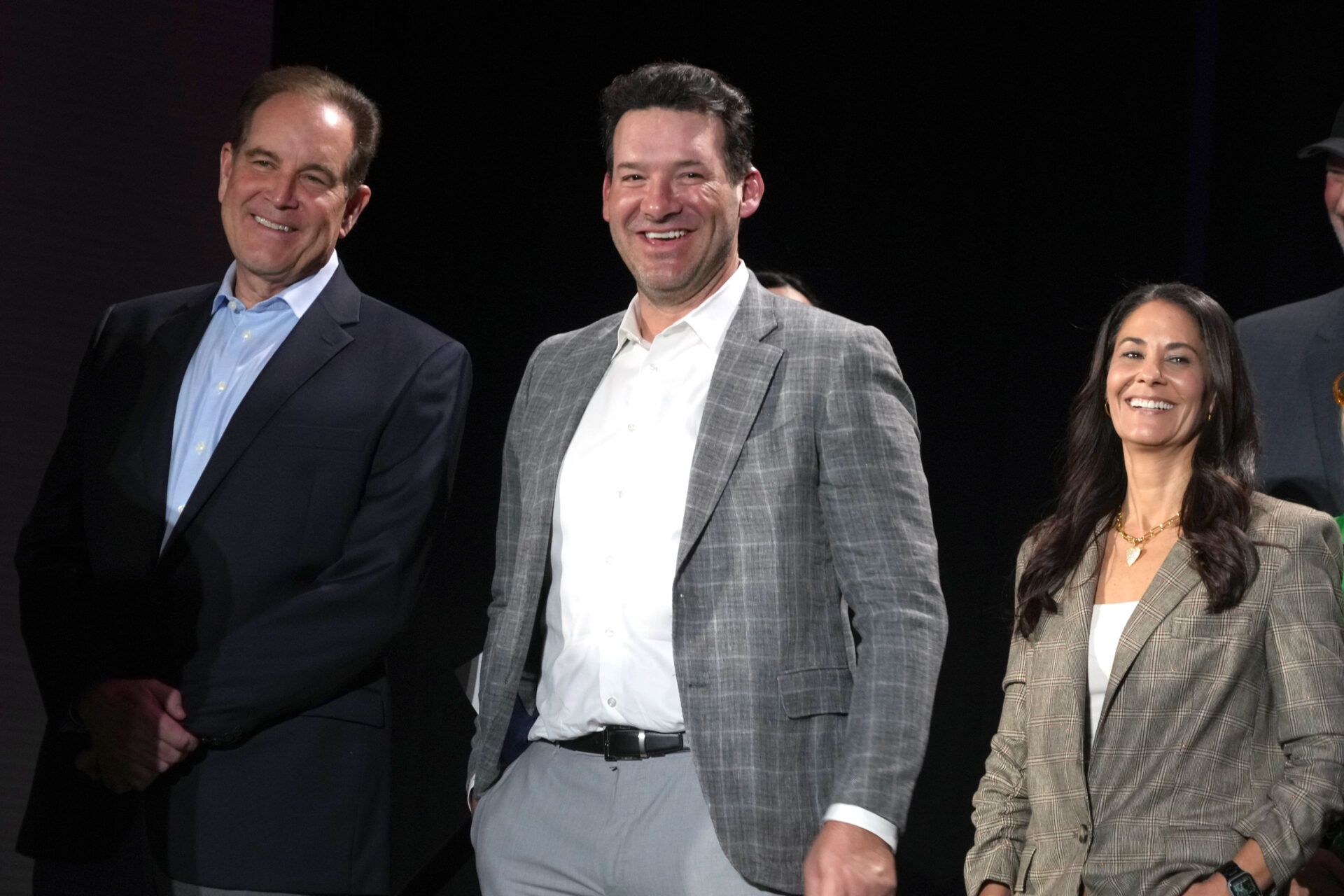 CBS Sports play-by-play announcer Jim Nantz (left), analyst Tony Romo (center) and sideline reporter Tracy Wolfson at press conference at the Super Bowl 58 Media Center at the Mandalay Bay Resort and Casino.