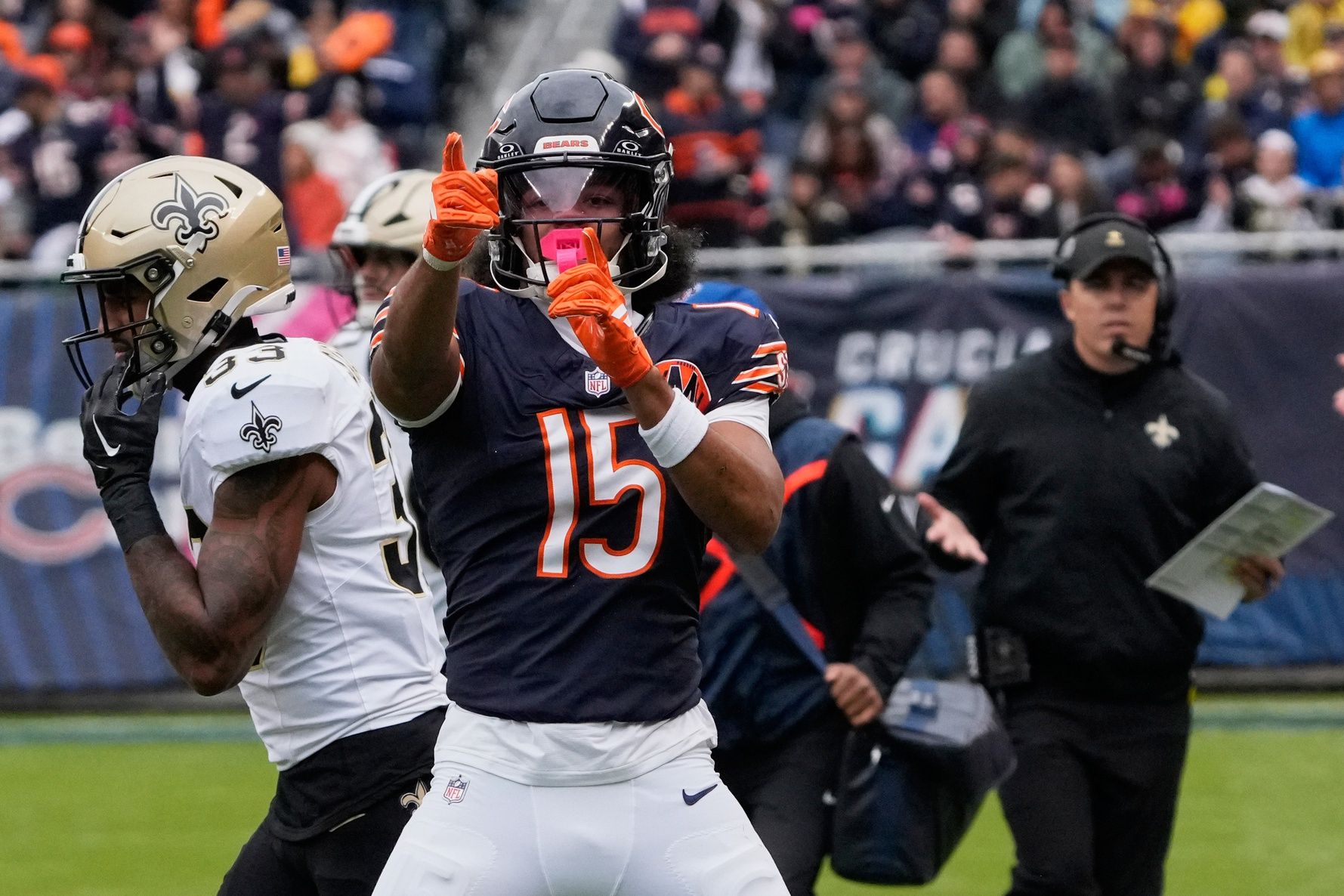 Chicago Bears wide receiver Rome Odunze (15) and New Orlenas Saints head coach Kellen Moore react after a Chicago first down during the first half at Soldier Field.