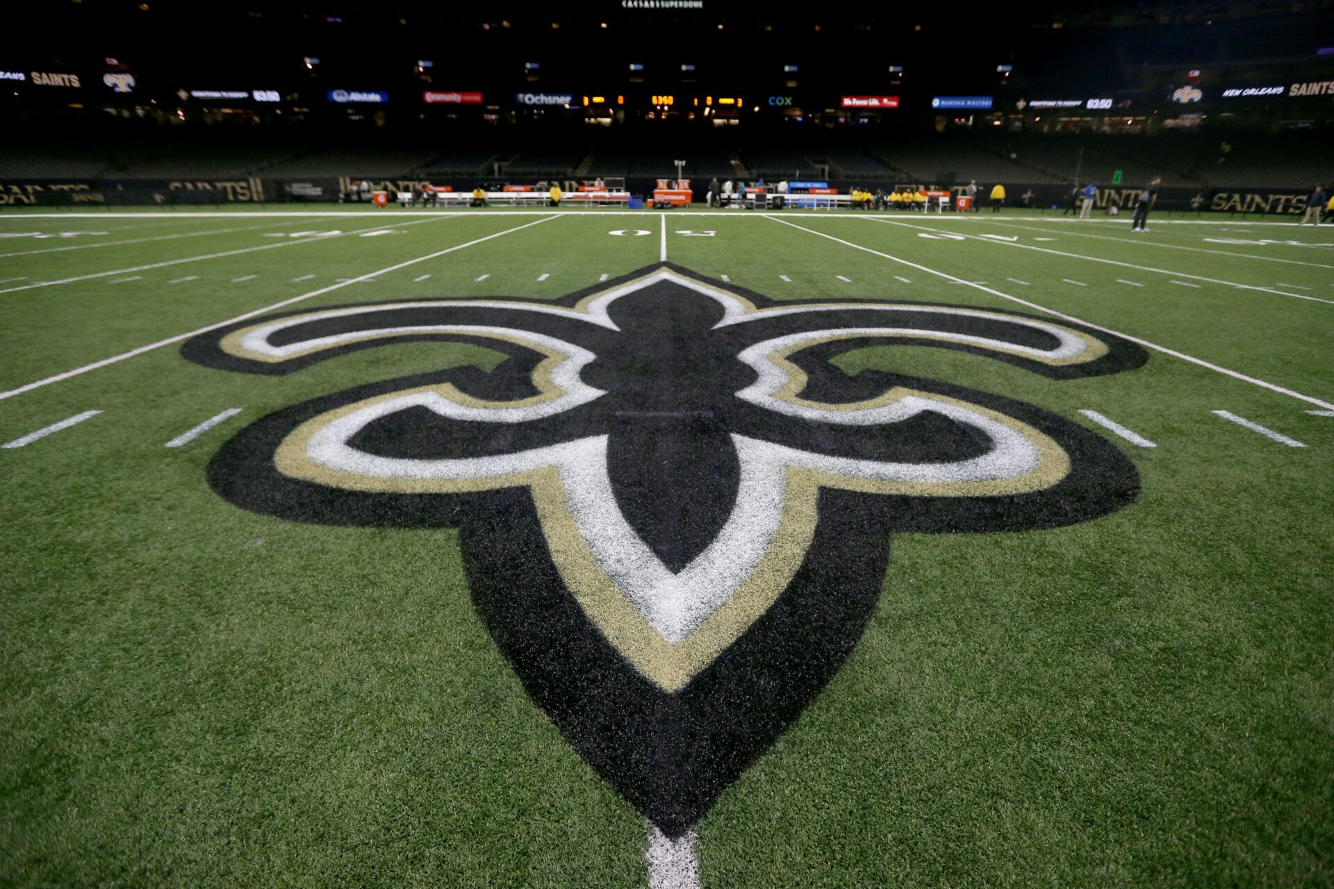 The New Orleans Saints logo on the field before their game against the Carolina Panthers at the Caesars Superdome.