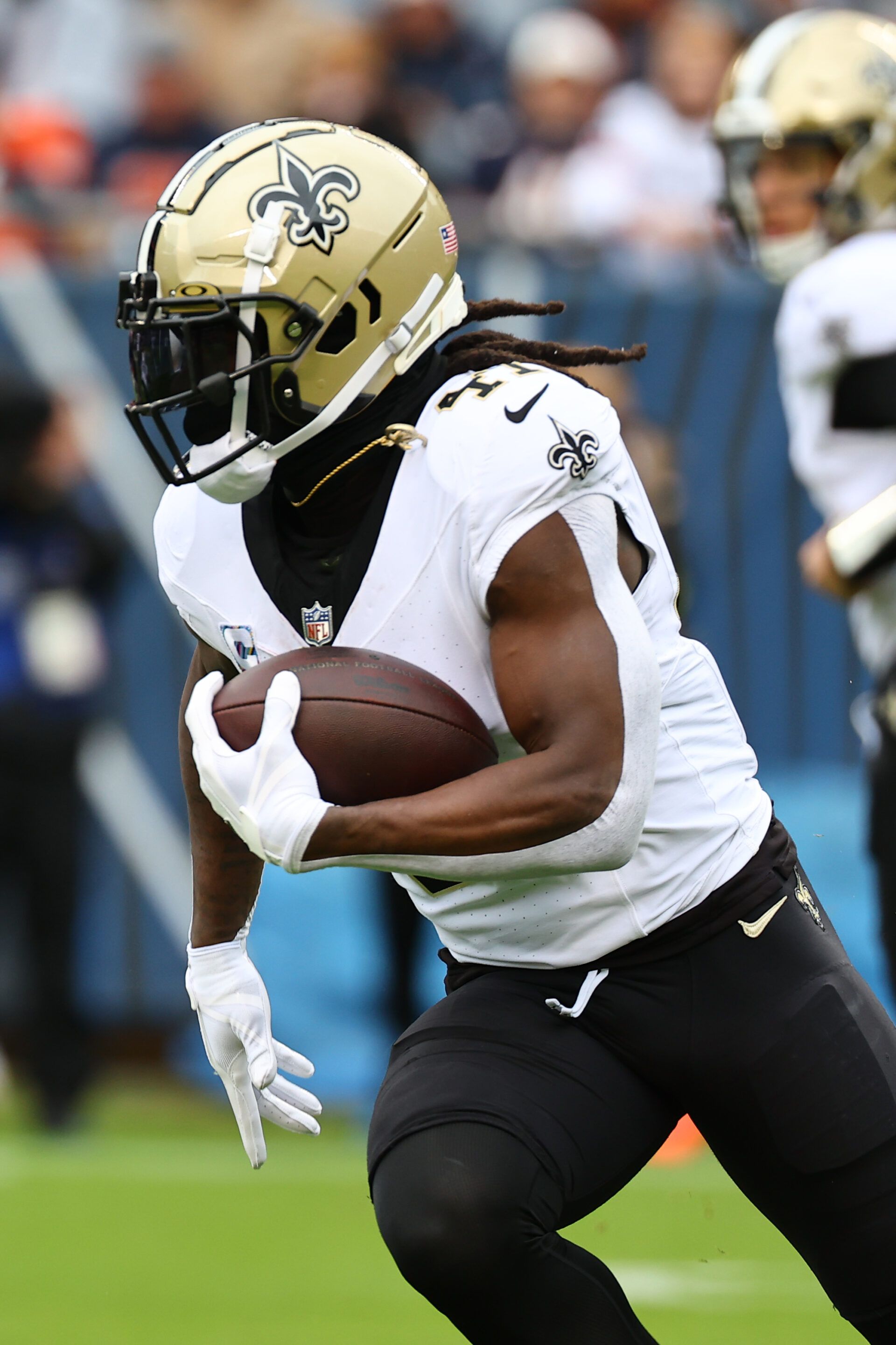 New Orleans Saints running back Alvin Kamara (41) rushes the ball against the Chicago Bears during the first quarter at Soldier Field.