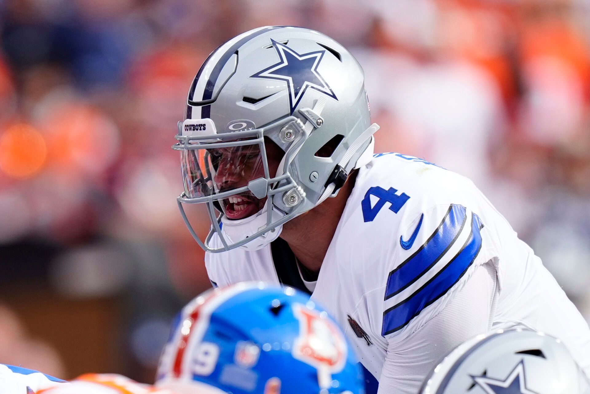 Dallas Cowboys quarterback Dak Prescott (4) calls a play in the first quarter against the Denver Broncos at Empower Field at Mile High.