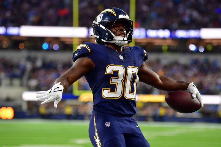 Los Angeles Chargers running back Kimani Vidal (30) reacts after scoring a touchdown against the Minnesota Vikings during the first half at SoFi Stadium.