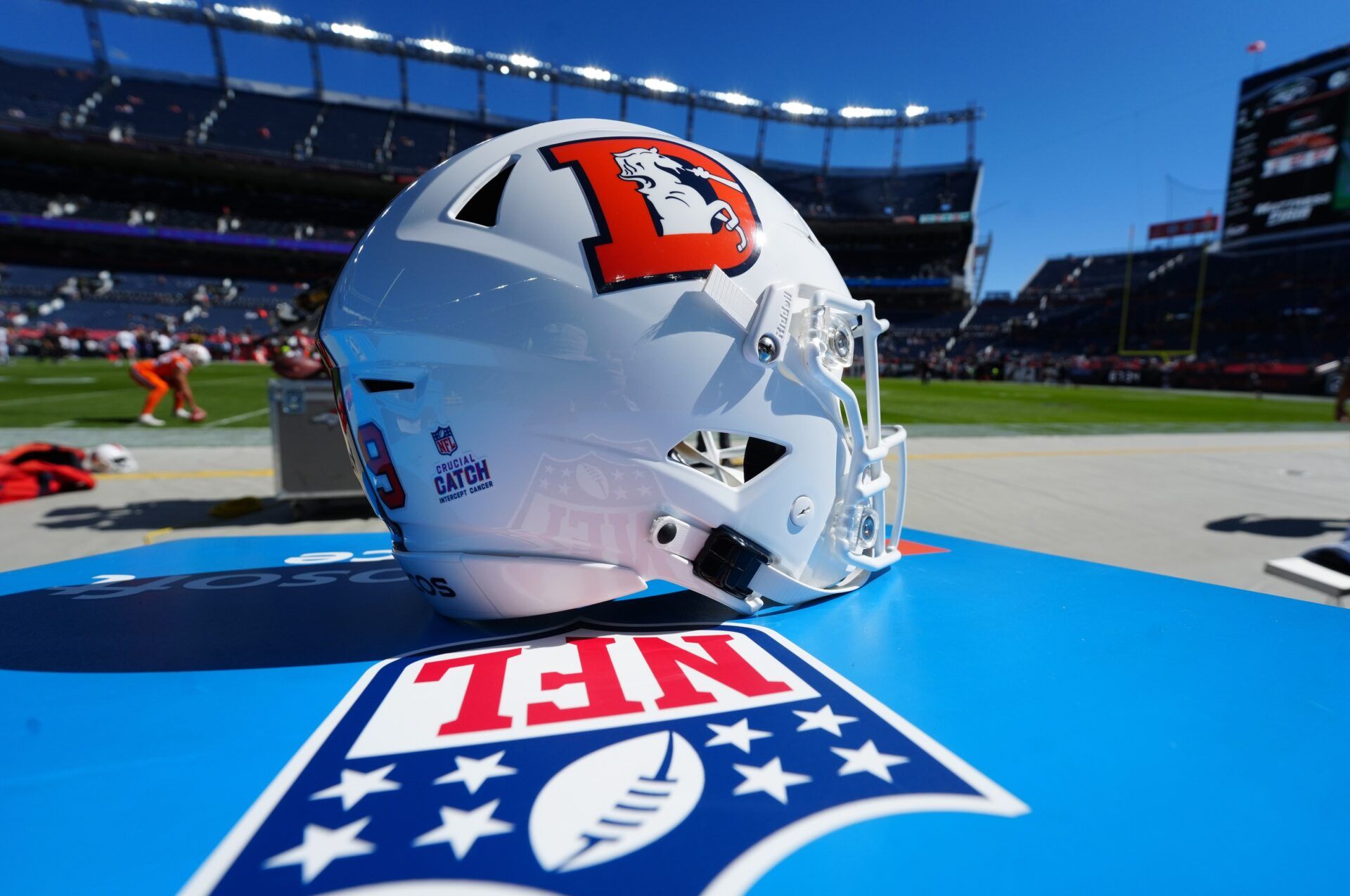 Detailed view of a White Cap edition Denver Broncos helmet worn by Denver Broncos punter Riley Dixon (9) before game against the New York Jets at Empower Field at Mile High.