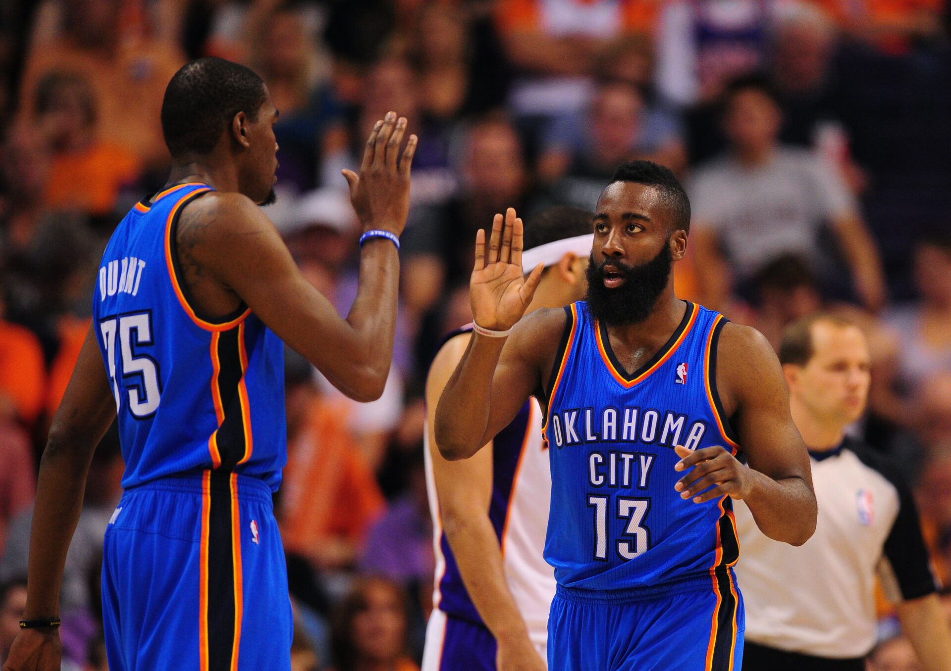 Apr. 18, 2012; Phoenix, AZ, USA; Oklahoma City Thunder foward Kevin Durant (left) celebrates with guard (13) James Harden in the second half against the Phoenix Suns at the US Airways Center.