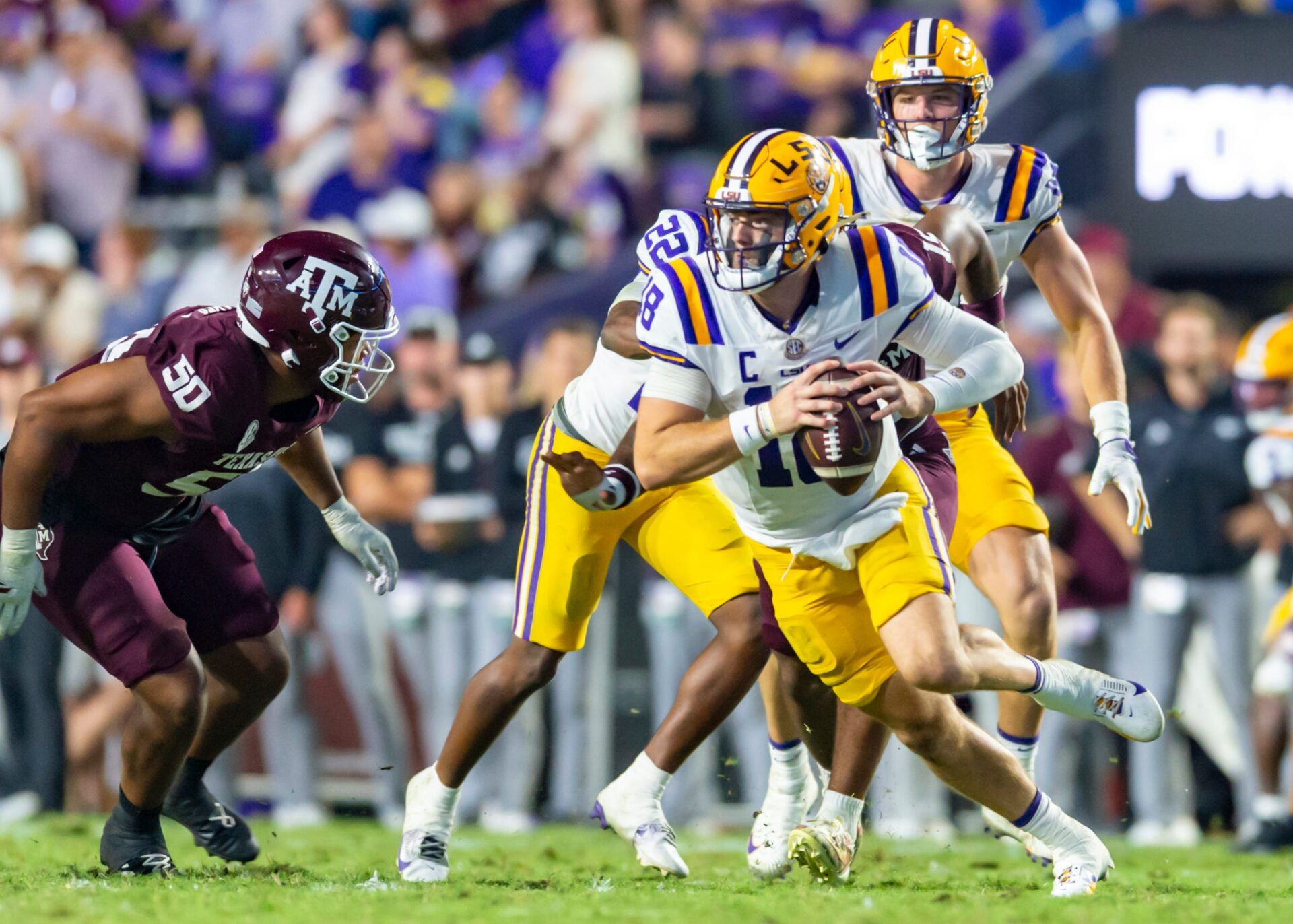 Tigers Quarterback Garrett Nussmeier 18 scrambles and is sacked by Linebacker Jaiden Bracker 15 as LSU Tigers take on the Texas A&M Aggies. October 25, 2025; Baton Rouge, Louisiana, USA; at Tiger Stadium. Saturday, Oct. 25, 2025.