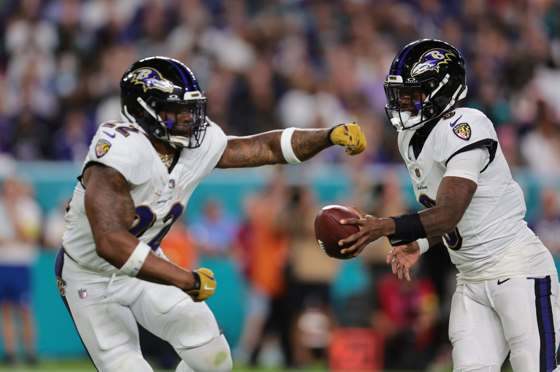 Baltimore Ravens quarterback Lamar Jackson (8) fakes a hand-off to running back Derrick Henry (22) during the second quarter against the Miami Dolphins at Hard Rock Stadium.