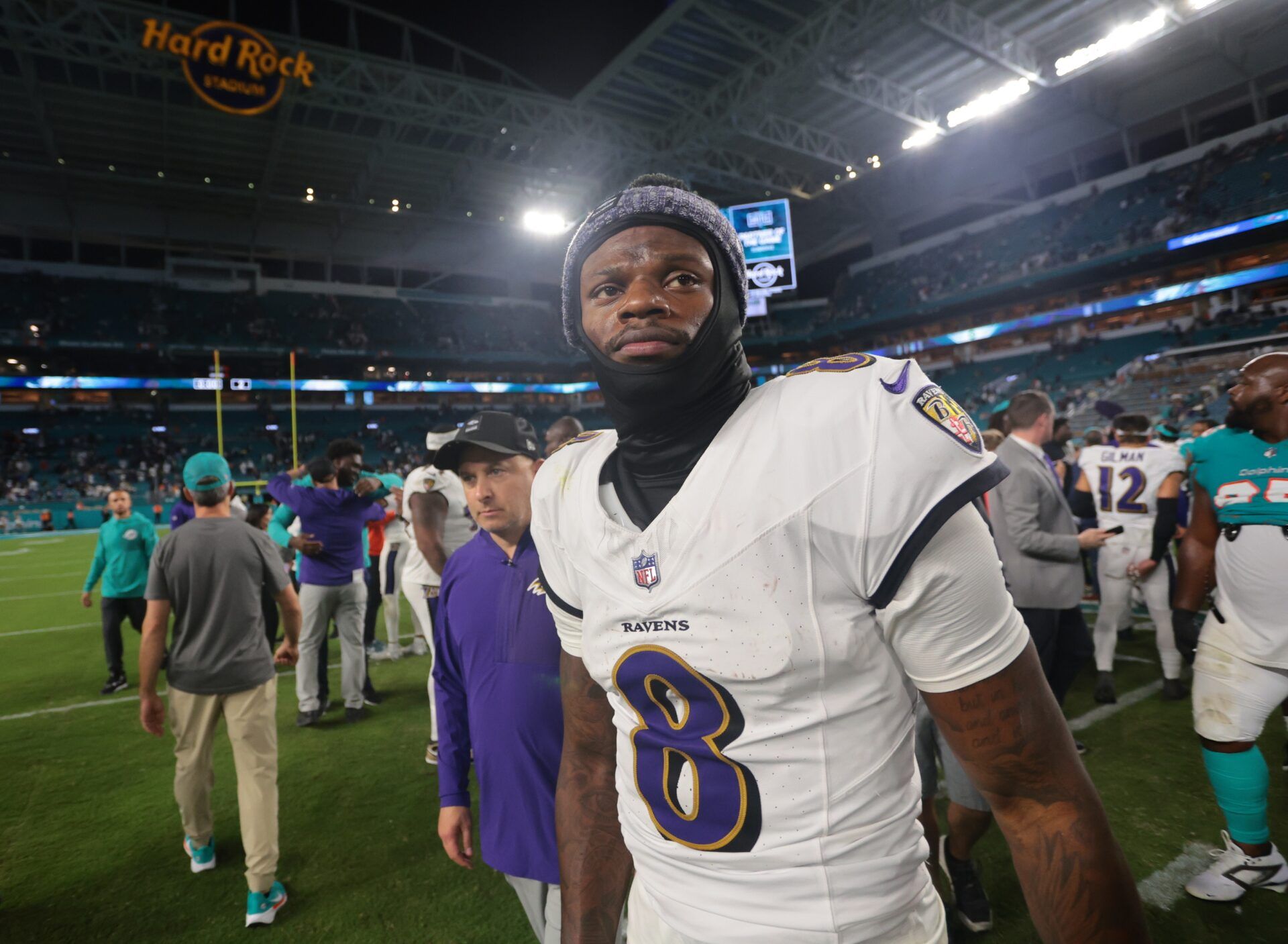 Baltimore Ravens quarterback Lamar Jackson (8) walks off the field after a win over Miami Dolphins at Hard Rock Stadium.