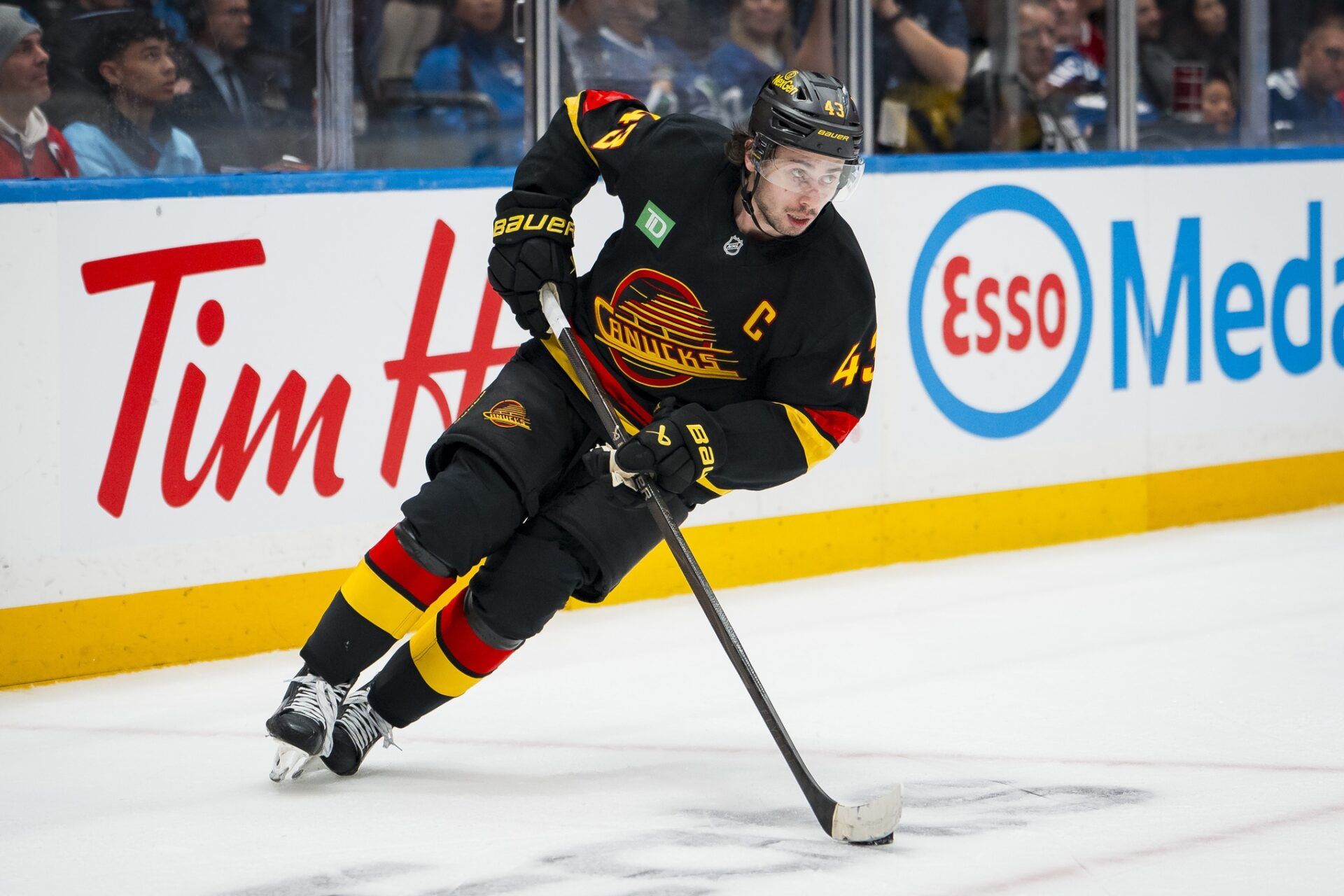 Vancouver Canucks defenseman Quinn Hughes (43) handles the puck against the Montreal Canadiens in the third period at Rogers Arena.