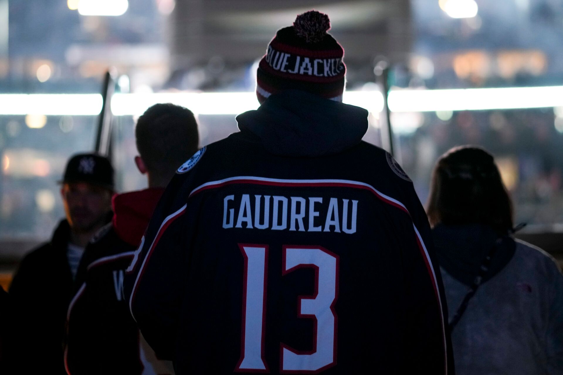 A fan wearing a Johnny Gaudreau jersey enters the seating area before the game between the Calgary Flames and the Columbus Blue Jackets at Nationwide Arena.