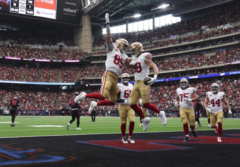 San Francisco 49ers tight end Jake Tonges (88) celebrates with tight end George Kittle (85) after a touchdown reception during the third quarter against the Houston Texans at NRG Stadium.