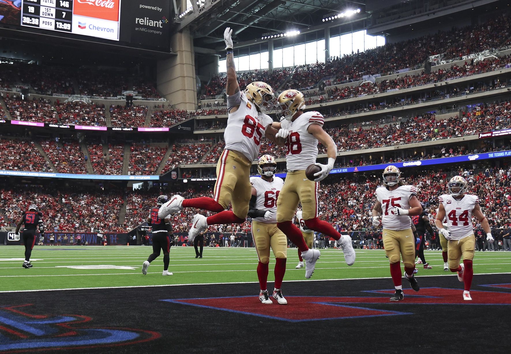 San Francisco 49ers tight end Jake Tonges (88) celebrates with tight end George Kittle (85) after a touchdown reception during the third quarter against the Houston Texans at NRG Stadium.