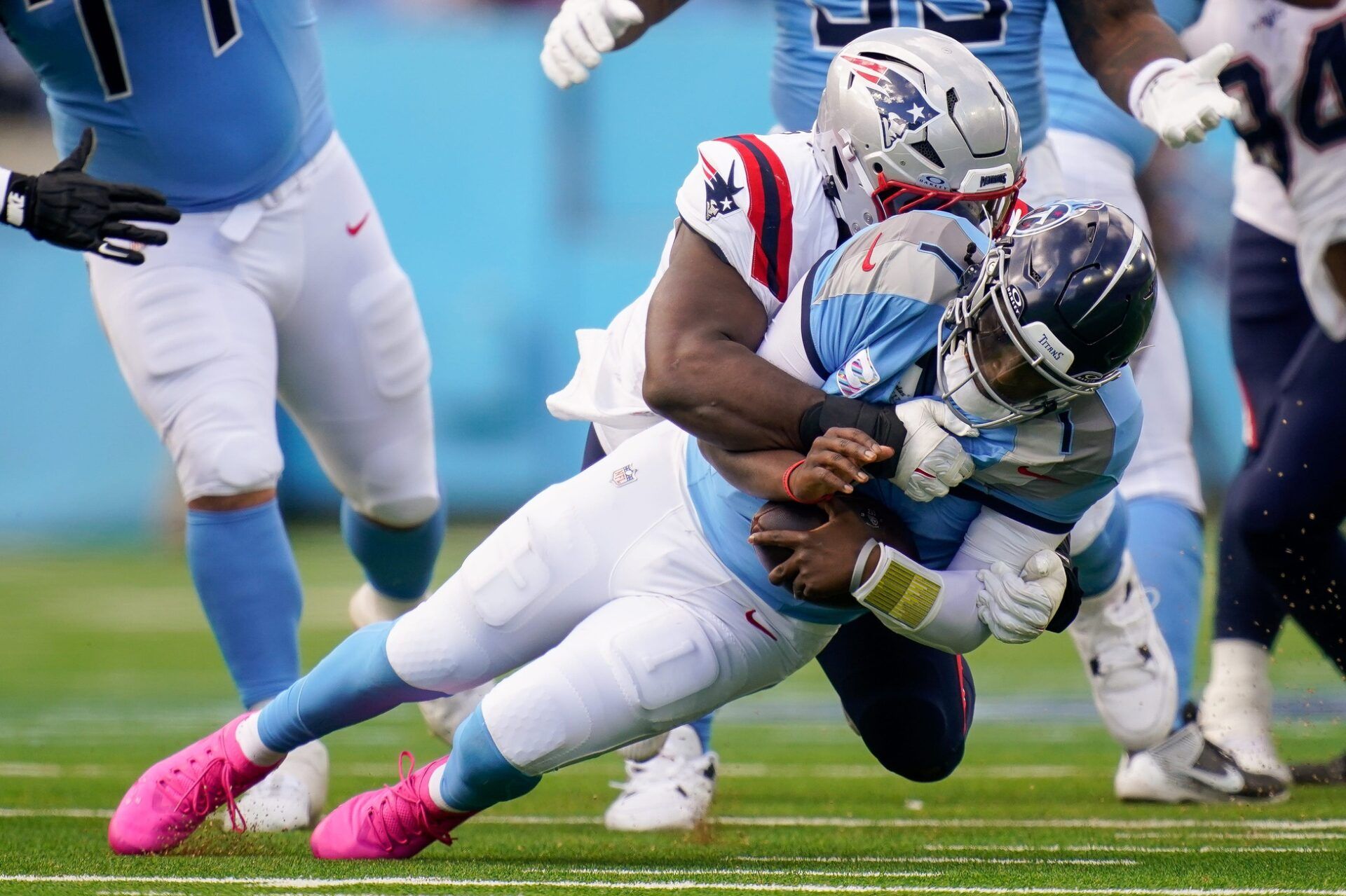 Tennessee Titans quarterback Cam Ward (1) is sacked by New England Patriots defensive end Milton Williams (97) during the third quarter at Nissan Stadium in Nashville, Tenn., Sunday, Oct. 19, 2025.