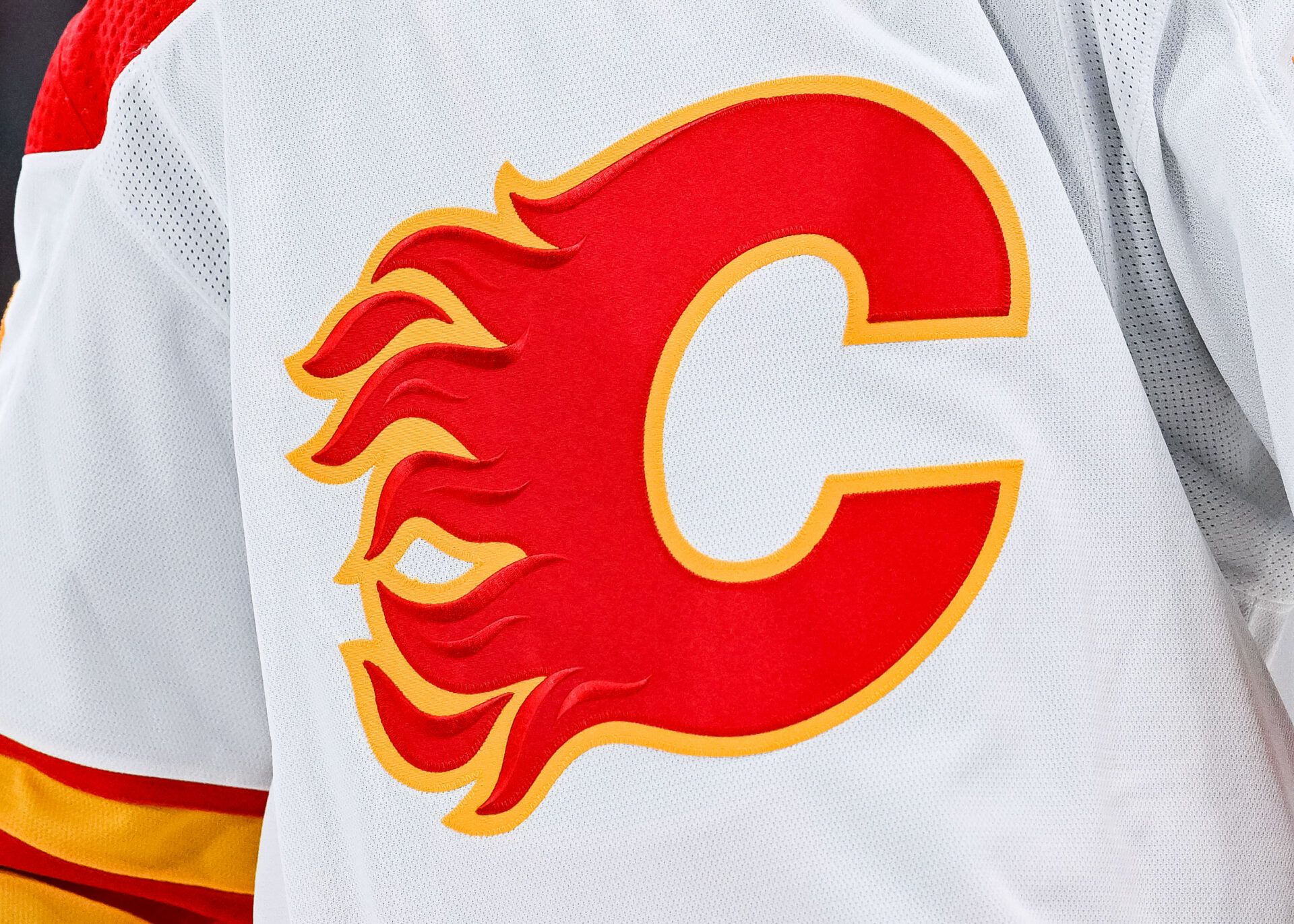 View of a Calgary Flames logo on a jersey worn by the member of the team during the second period at Bell Centre.
