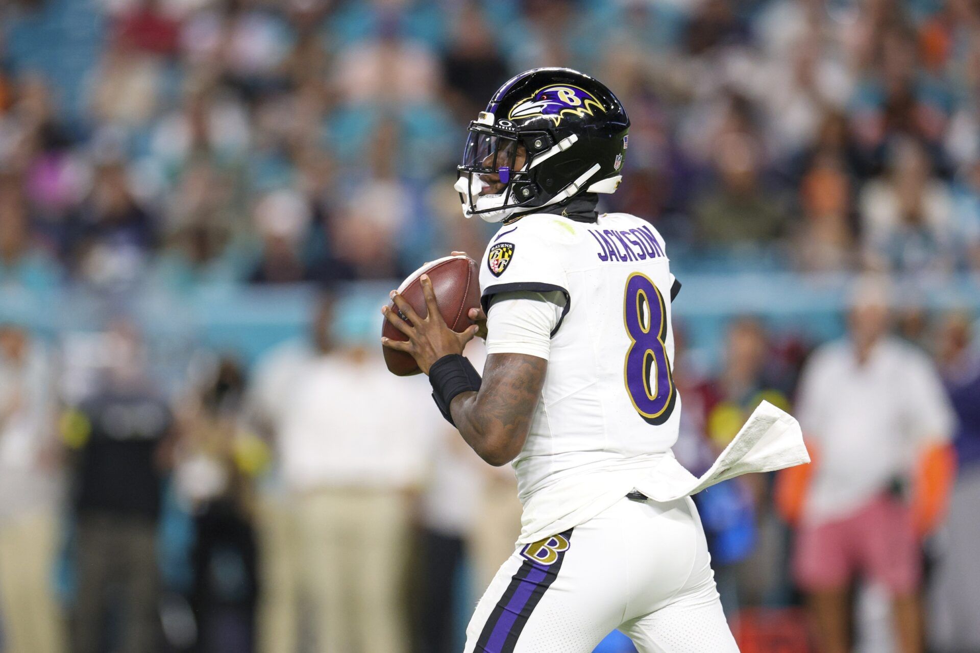 Baltimore Ravens quarterback Lamar Jackson (8) looks to pass against the Miami Dolphins in the second quarter at Hard Rock Stadium.