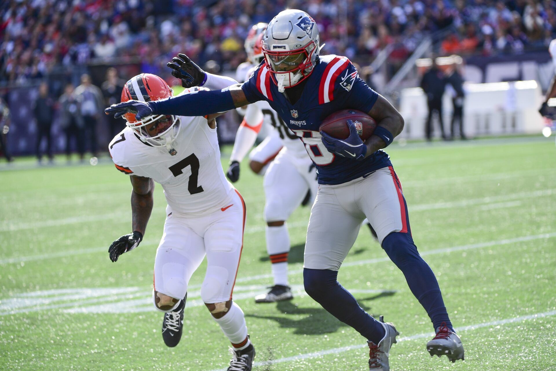 New England Patriots wide receiver Stefon Diggs (8) makes a catch against Cleveland Browns cornerback Tyson Campbell (7) during the second quarter at Gillette Stadium.