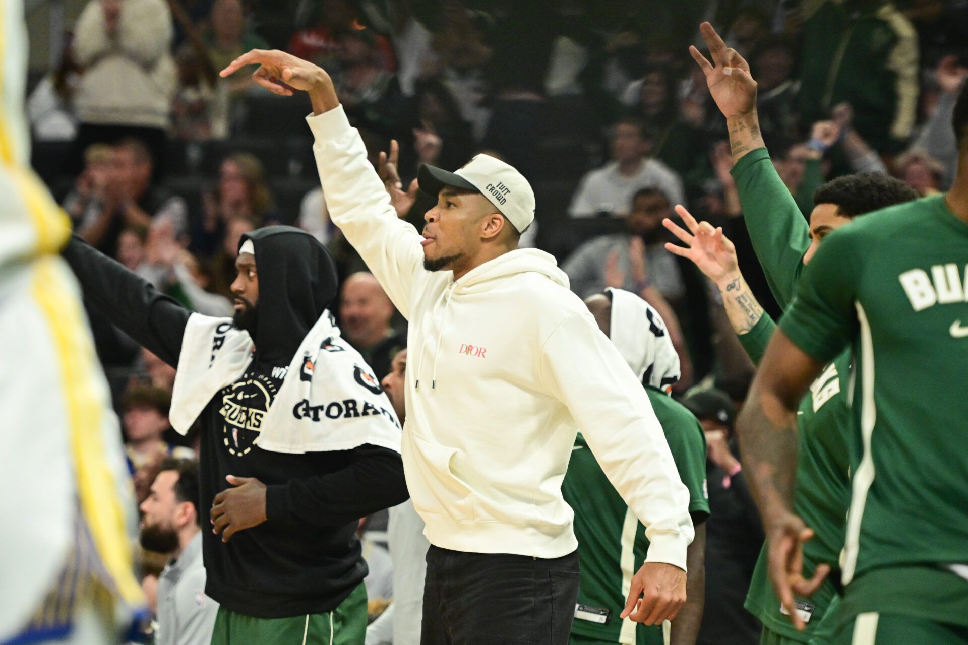 Milwaukee Bucks forward Giannis Antetokounmpo (34), who did not play, cheers the team in the 4th quarter against the Golden State Warriors at Fiserv Forum.