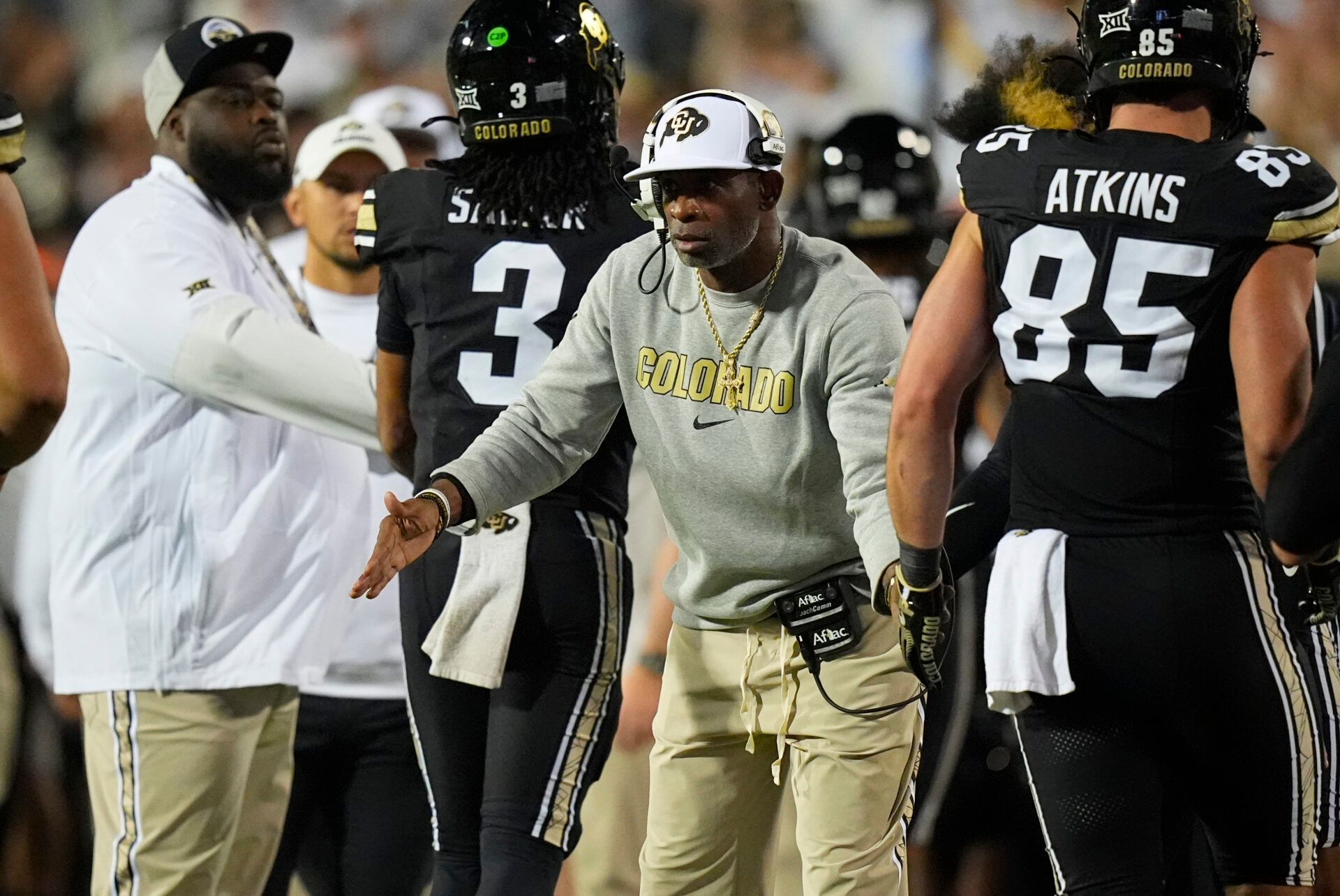 Colorado Buffaloes head coach Deion Sanders celebrates a touchdown with his players in the fourth quarter against the Wyoming Cowboys at Folsom Field.