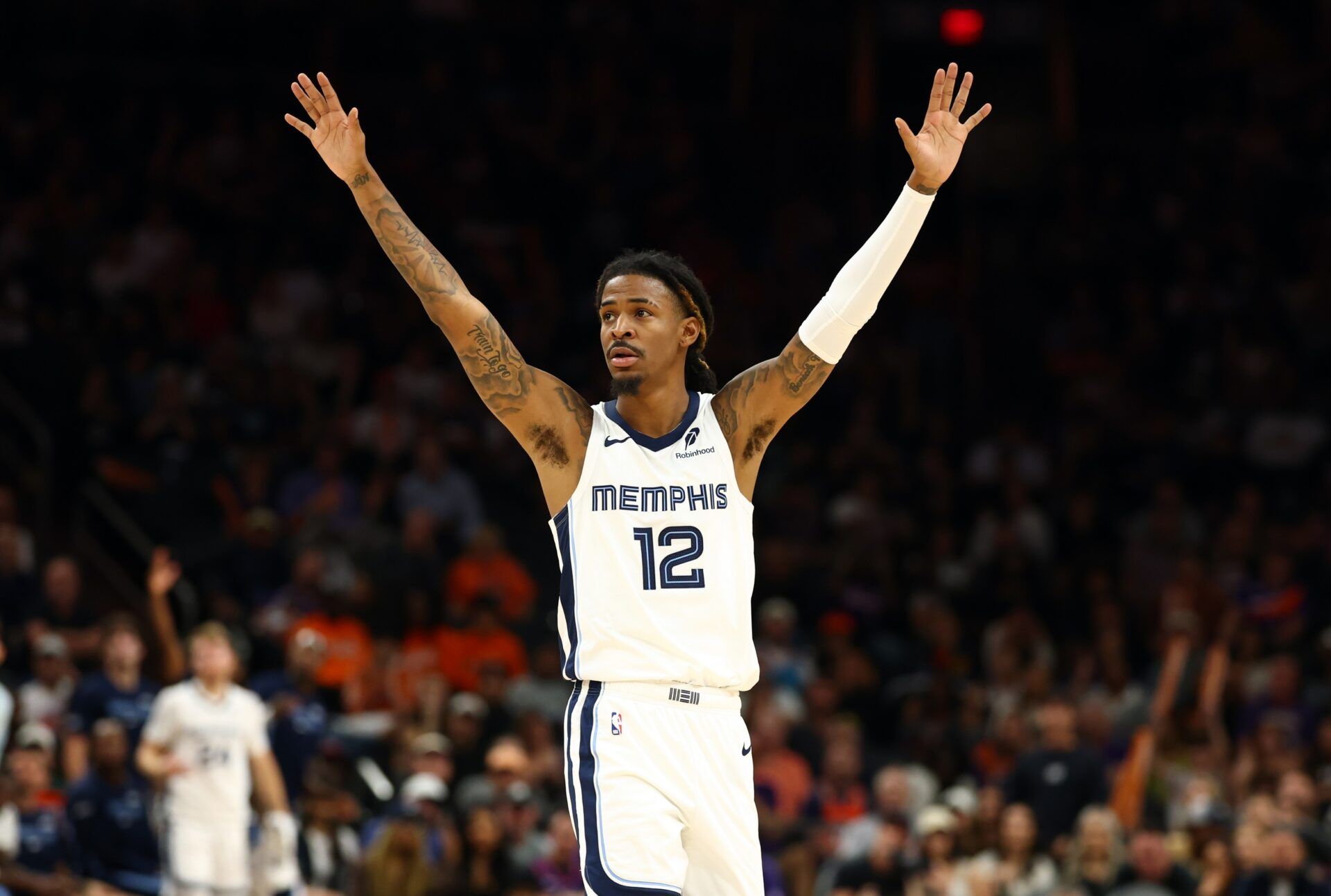 Memphis Grizzlies guard Ja Morant (12) reacts against the Phoenix Suns during the second half at the Mortgage Matchup Center.