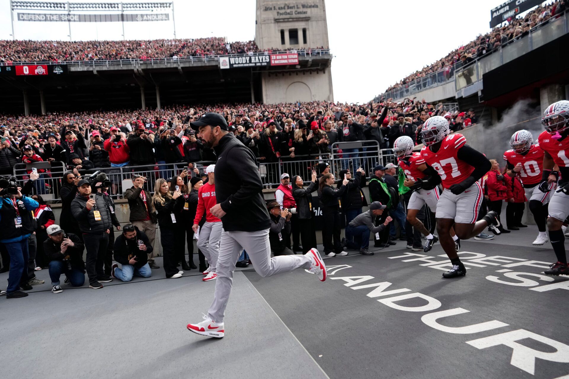 Ohio State Buckeyes head coach Ryan Day leads his team on the field for the NCAA football game against the Penn State Nittany Lions at Ohio Stadium in Columbus on Nov. 1, 2025.