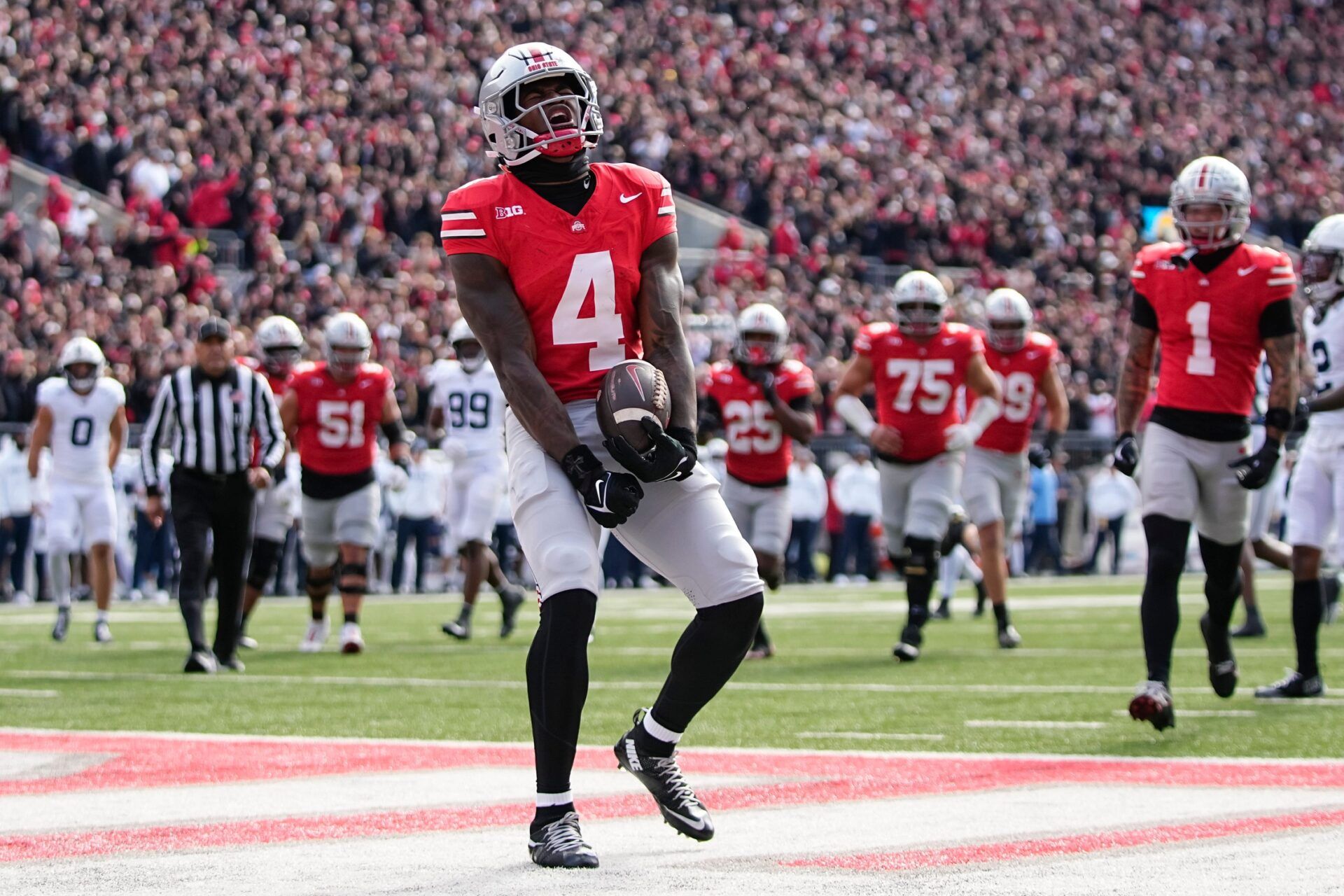 Ohio State Buckeyes wide receiver Jeremiah Smith (4) celebrates a touchdown during the NCAA football game against the Penn State Nittany Lions at Ohio Stadium in Columbus on Nov. 1, 2025.