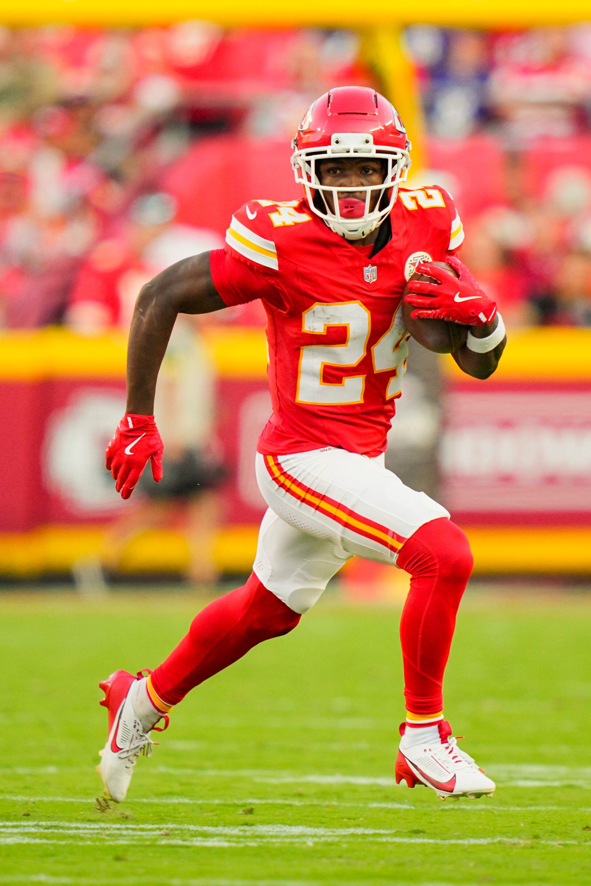 Kansas City Chiefs running back Brashard Smith (24) runs the ball during the second half against the Baltimore Ravens at GEHA Field at Arrowhead Stadium.
