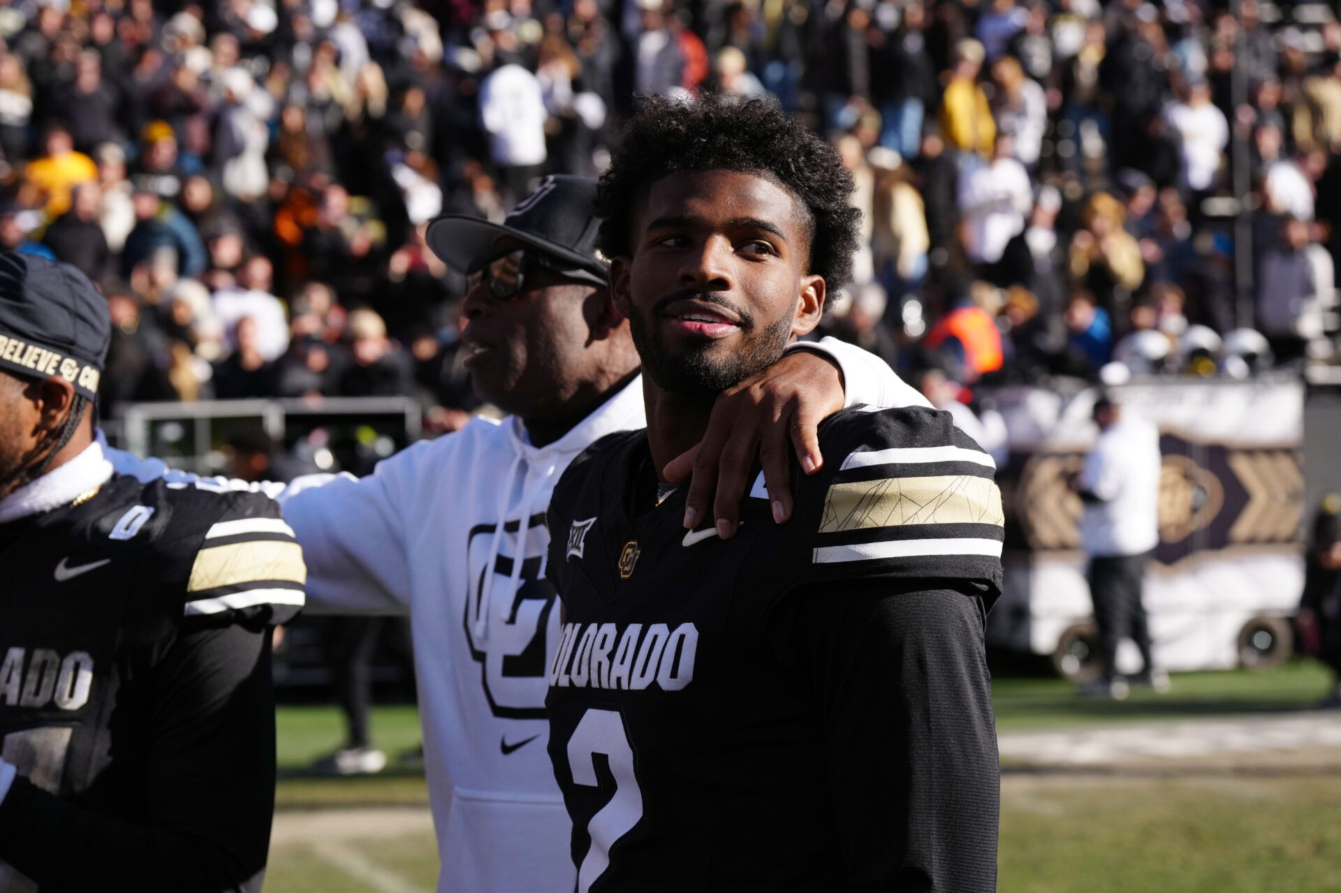 Colorado Buffaloes quarterback Shedeur Sanders (2) and head coach Deion Sanders ifollowing the win over the Oklahoma State Cowboys at Folsom Field.