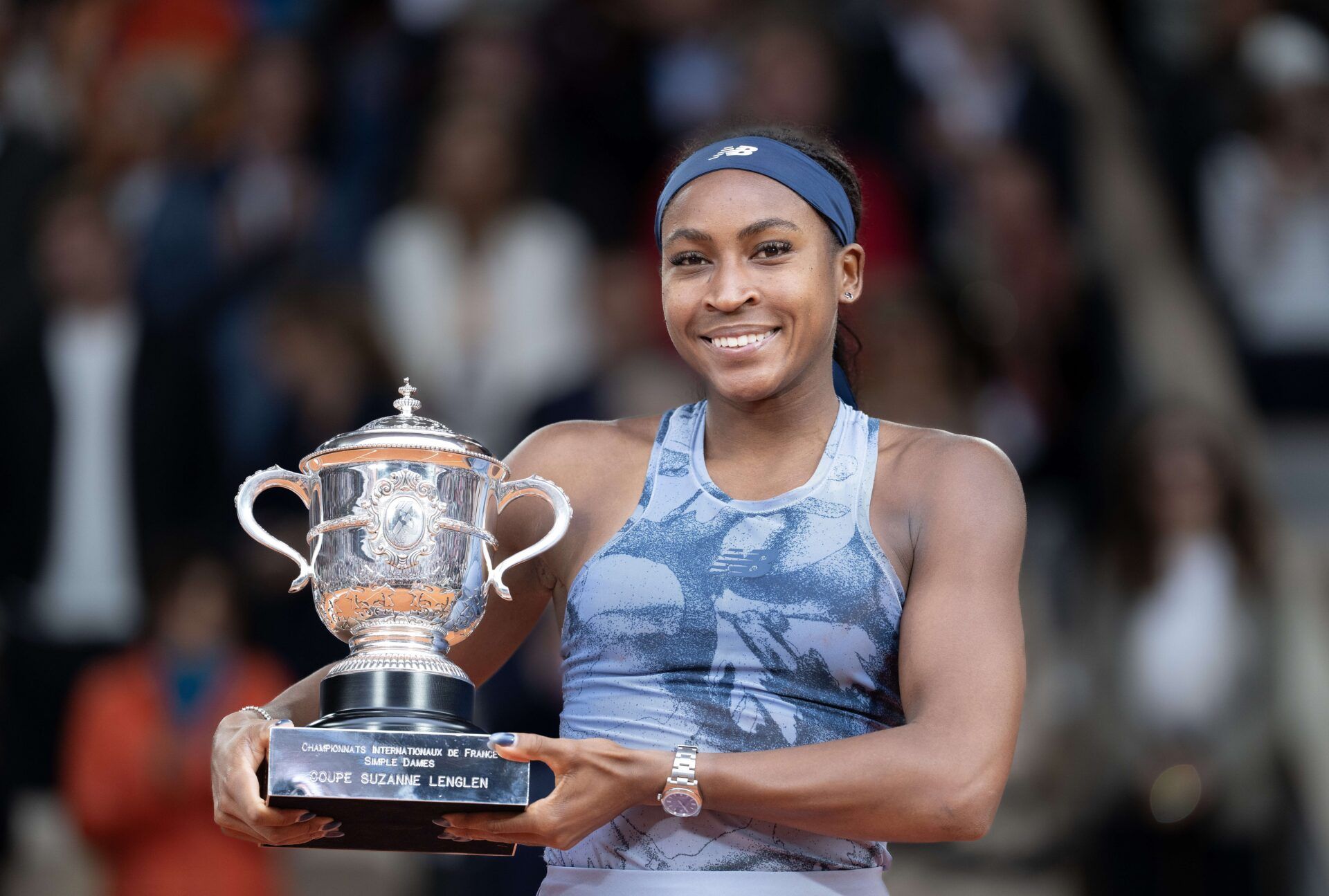 Coco Gauff of the United States poses with the trophy after winning the womens singles final against Aryna Sabalenka on day 14 at Roland Garros Stadium.