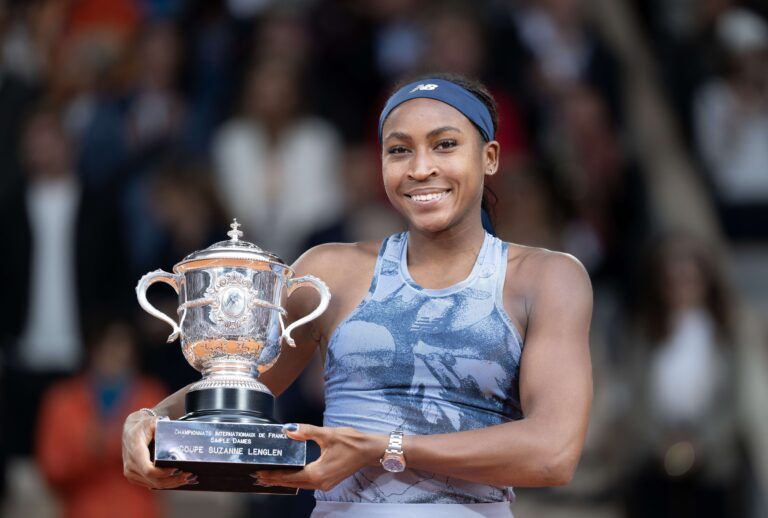 Coco Gauff of the United States poses with the trophy after winning the womens singles final against Aryna Sabalenka on day 14 at Roland Garros Stadium.