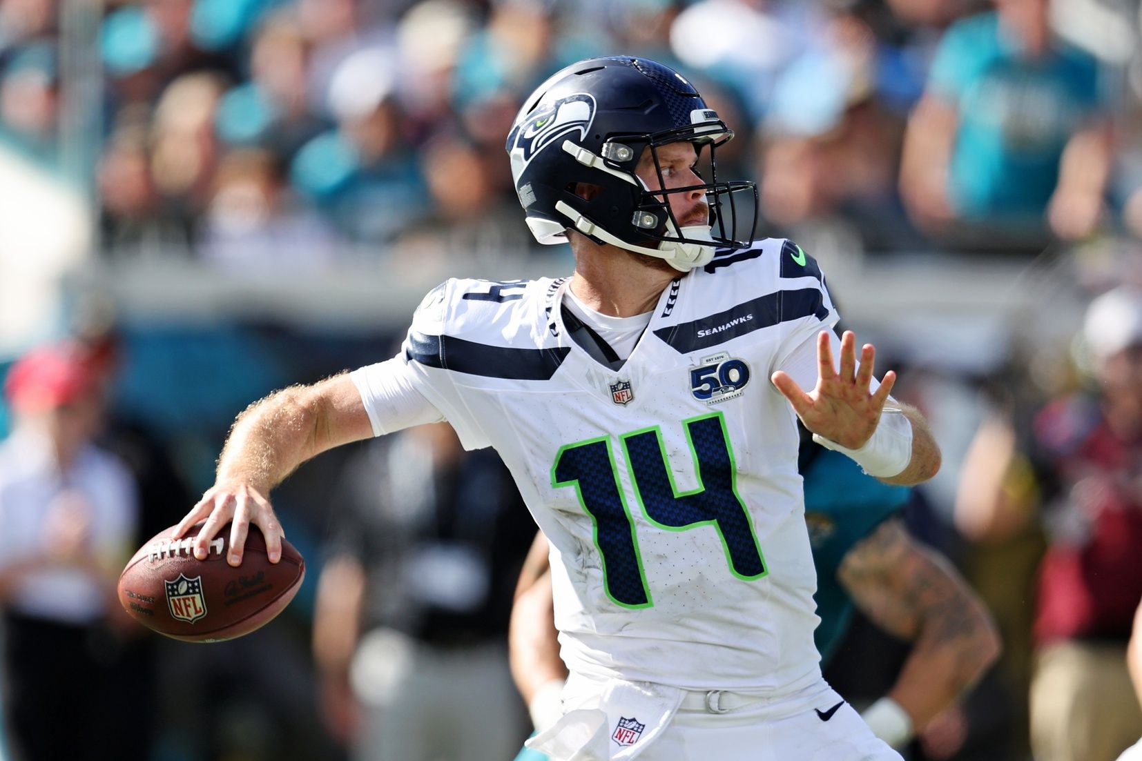 Seattle Seahawks quarterback Sam Darnold (14) drops back to make a pass during the second half against the Jacksonville Jaguars at EverBank Stadium.