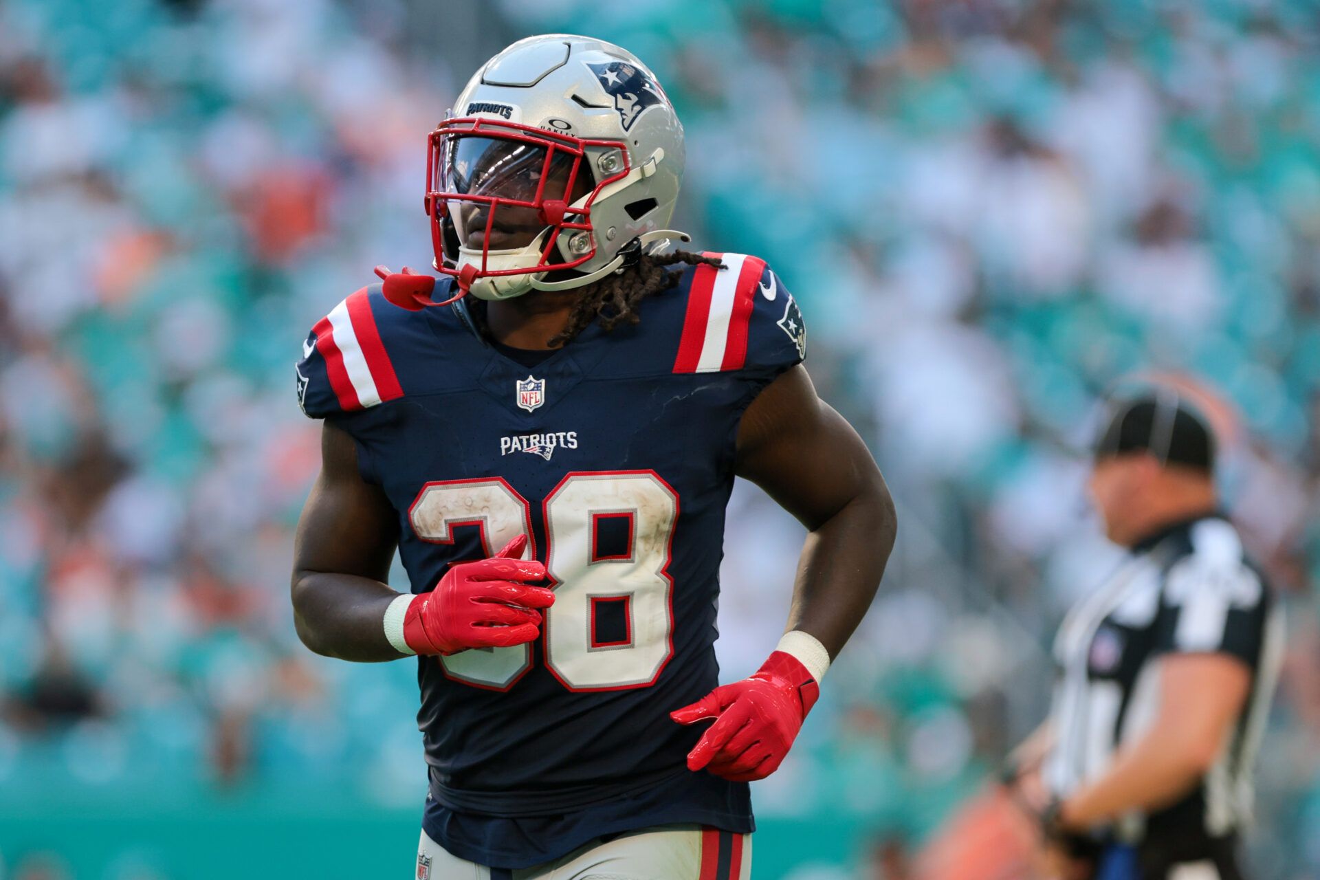 New England Patriots running back Rhamondre Stevenson (38) looks on against the Miami Dolphins during the fourth quarter at Hard Rock Stadium.