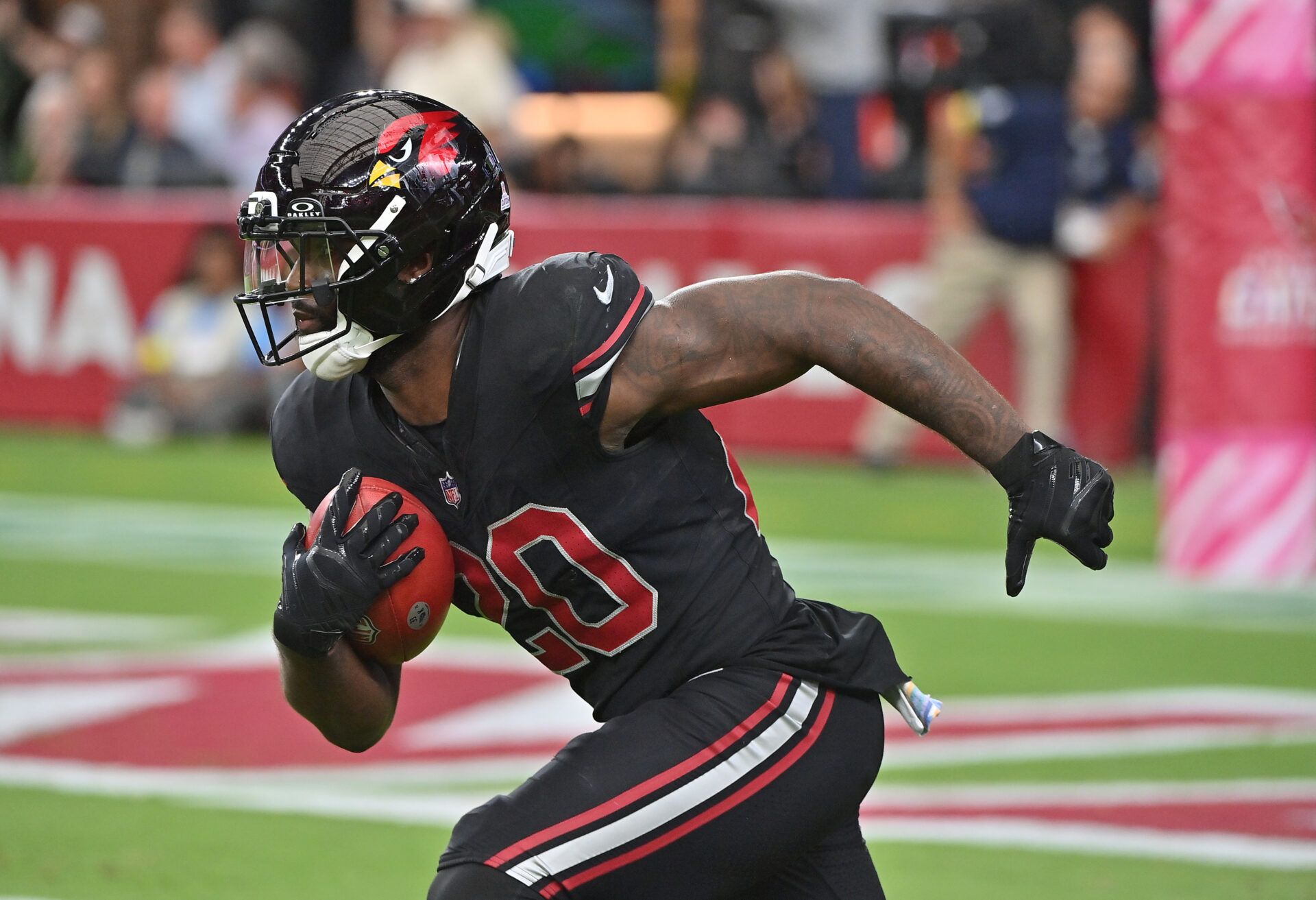 Arizona Cardinals running back Bam Knight (20) returns a kickoff against the Tennessee Titans during the fourth quarter at State Farm Stadium.
