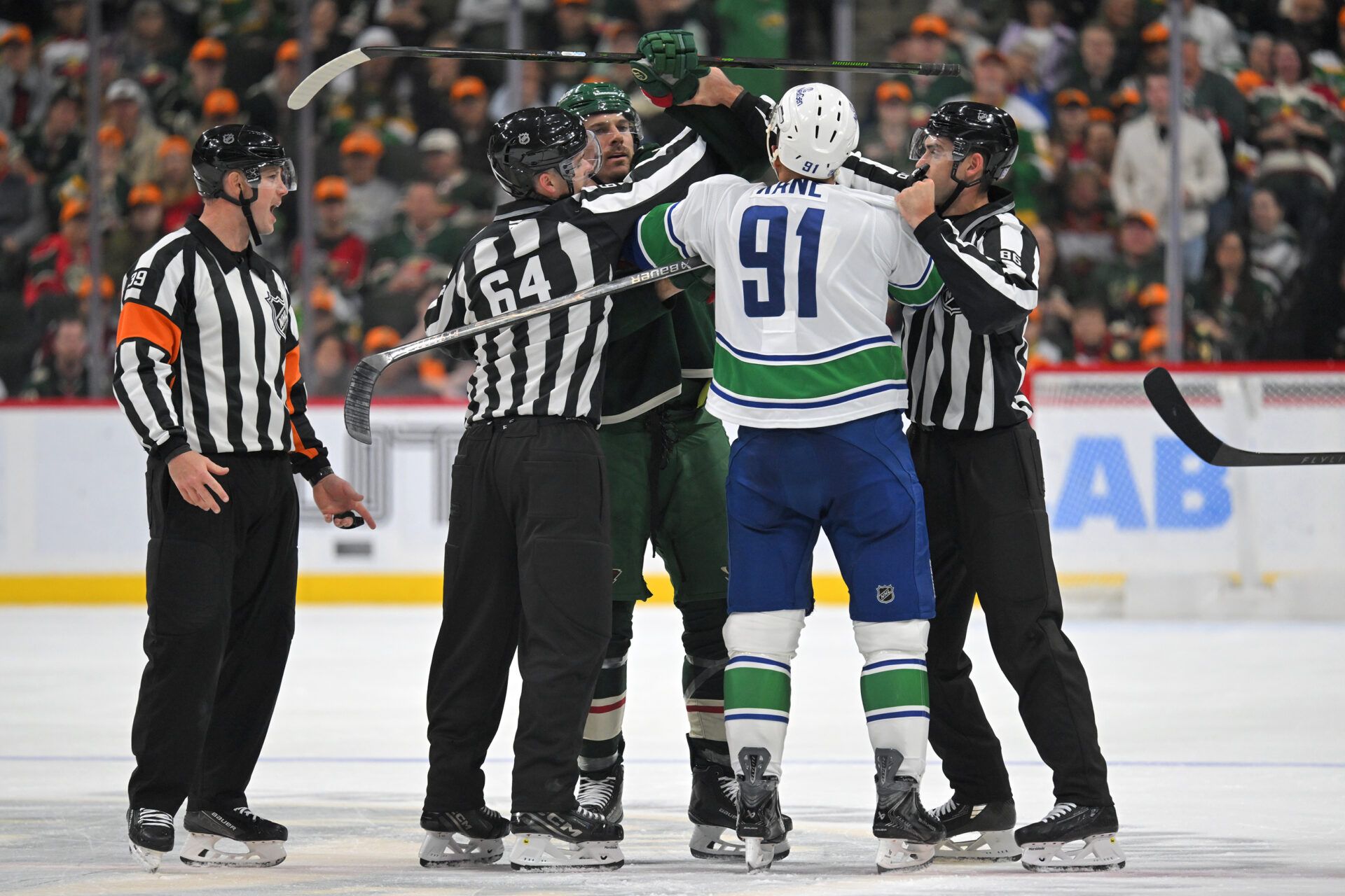 Minnesota Wild forward Marcus Foligno (17) and Vancouver Canucks forward Evander Kane (91) would each receive 10-minute game misconduct penalties after this altercation during the third period at Grand Casino Arena.