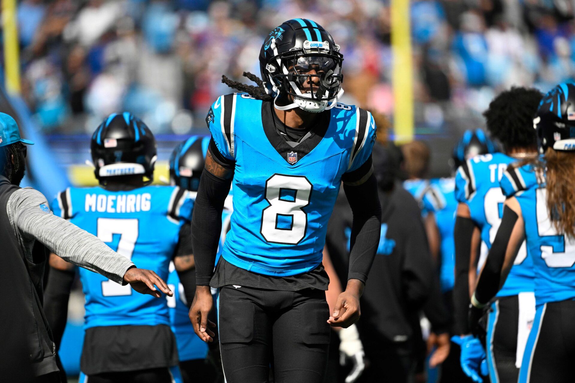 Carolina Panthers cornerback Jaycee Horn (8) runs on to the field before the game at Bank of America Stadium.